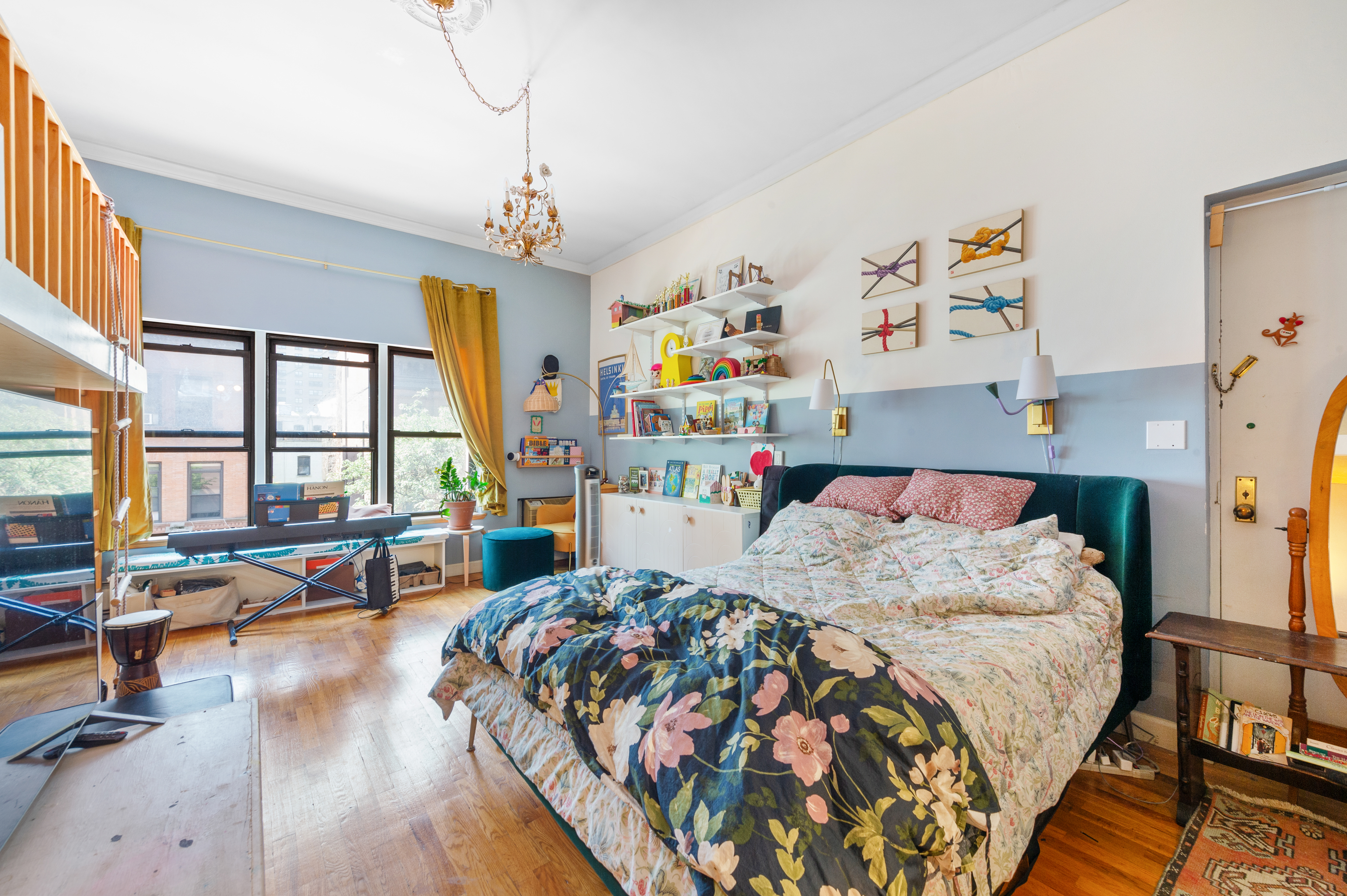 261 West 71st Street, Unit 8 Manhattan, NY 10023 - Photo 5 of 15 a bedroom with bed and a large window