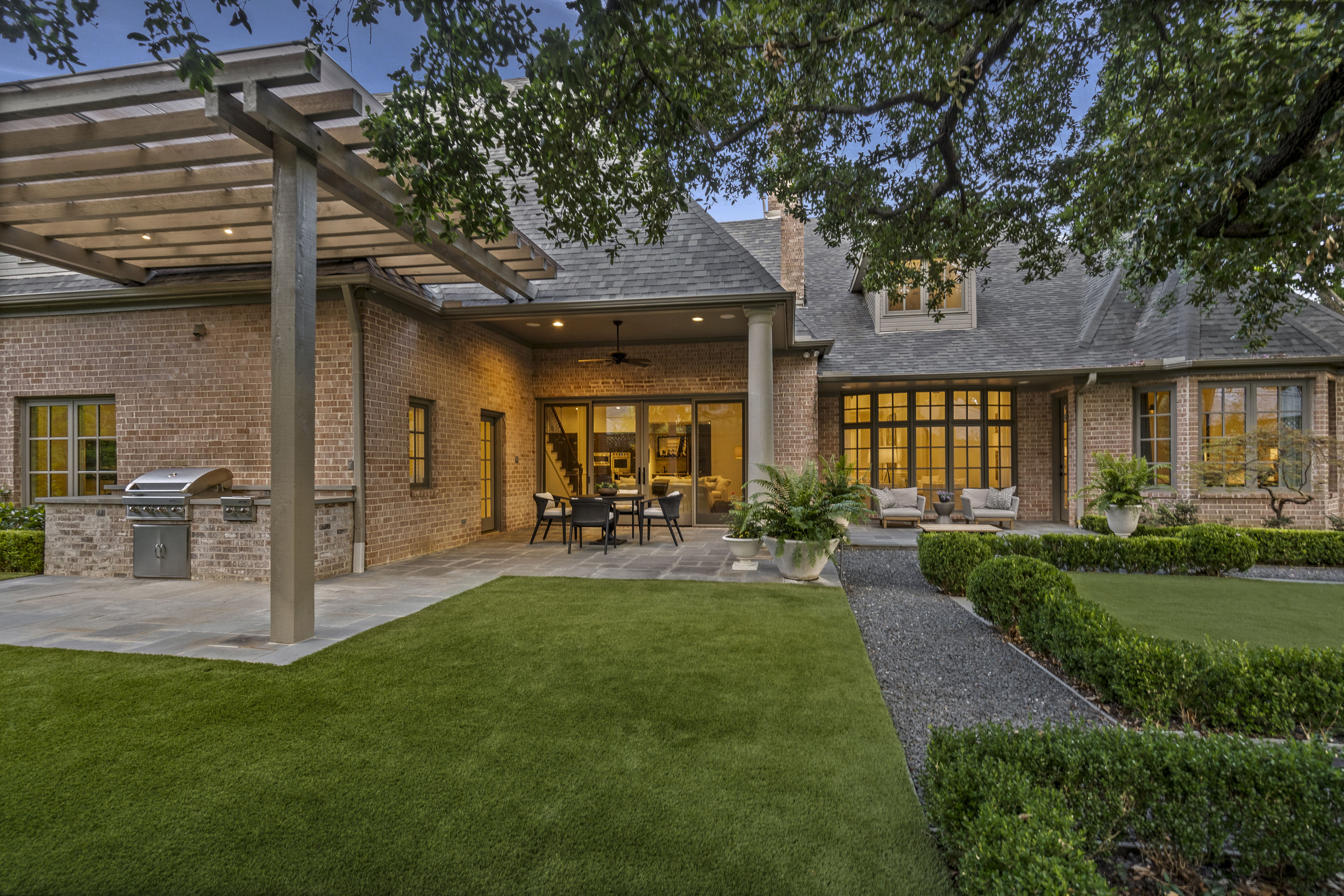 6607 Meadow Road Dallas, TX 75230 - Photo 27 of 32 a view of a house with backyard porch and sitting area
