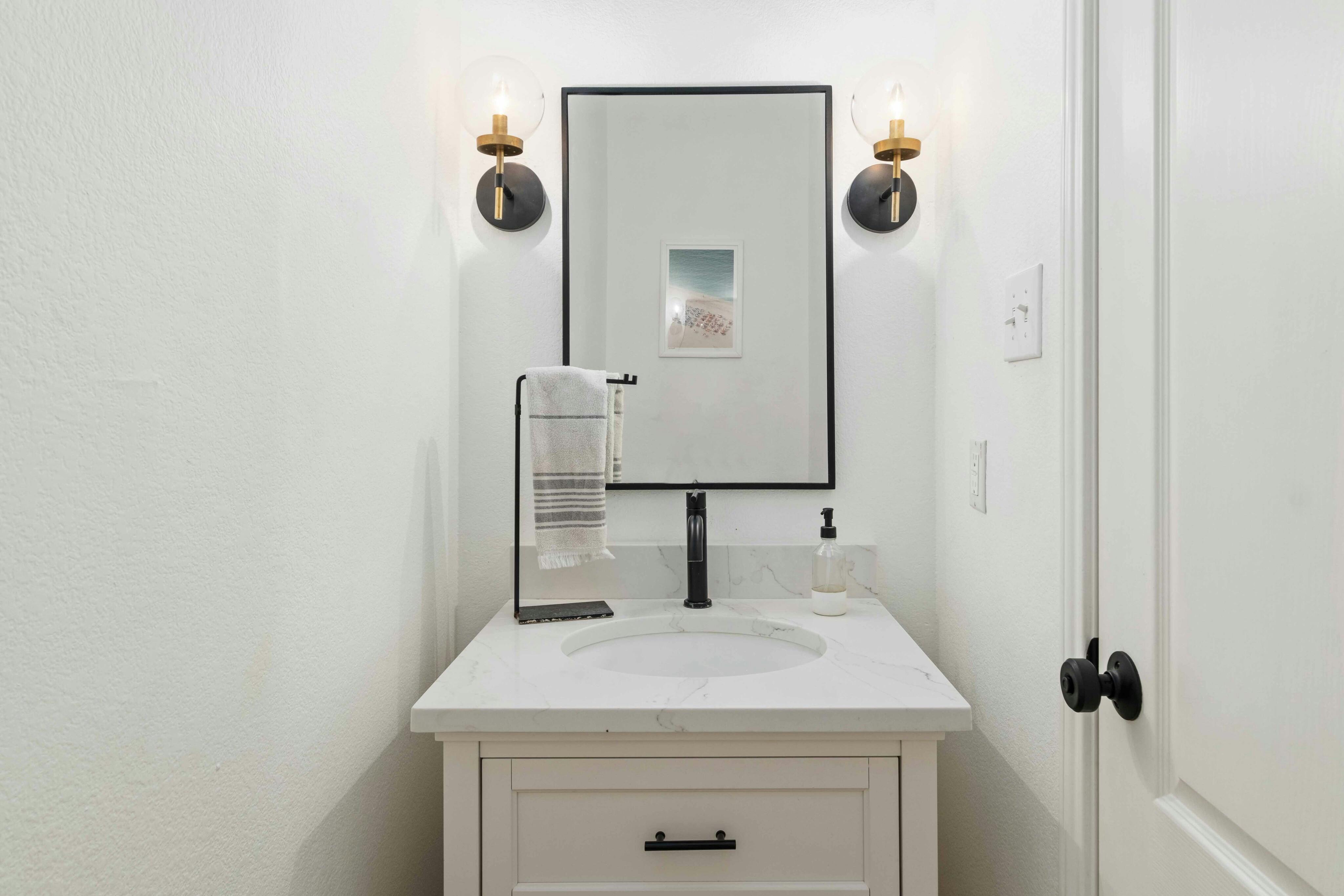 10608 Pointe View Drive Austin, TX 78738 - Photo 16 of 46 a bathroom with a sink and a mirror