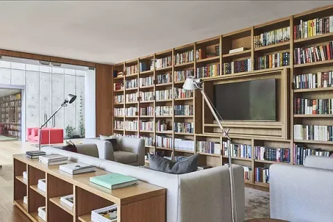 a view of a livingroom with furniture and staircase