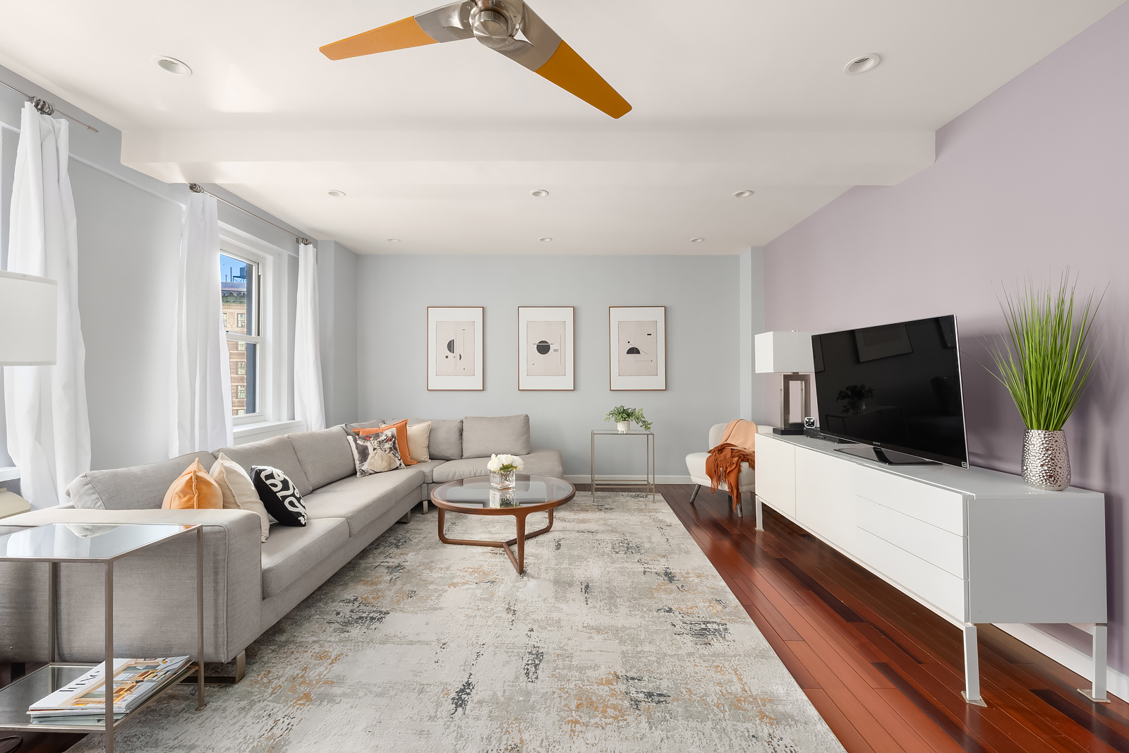 2166 Broadway, Unit 5D Manhattan, NY 10024 - Photo 2 of 11 a living room with furniture and a flat screen tv