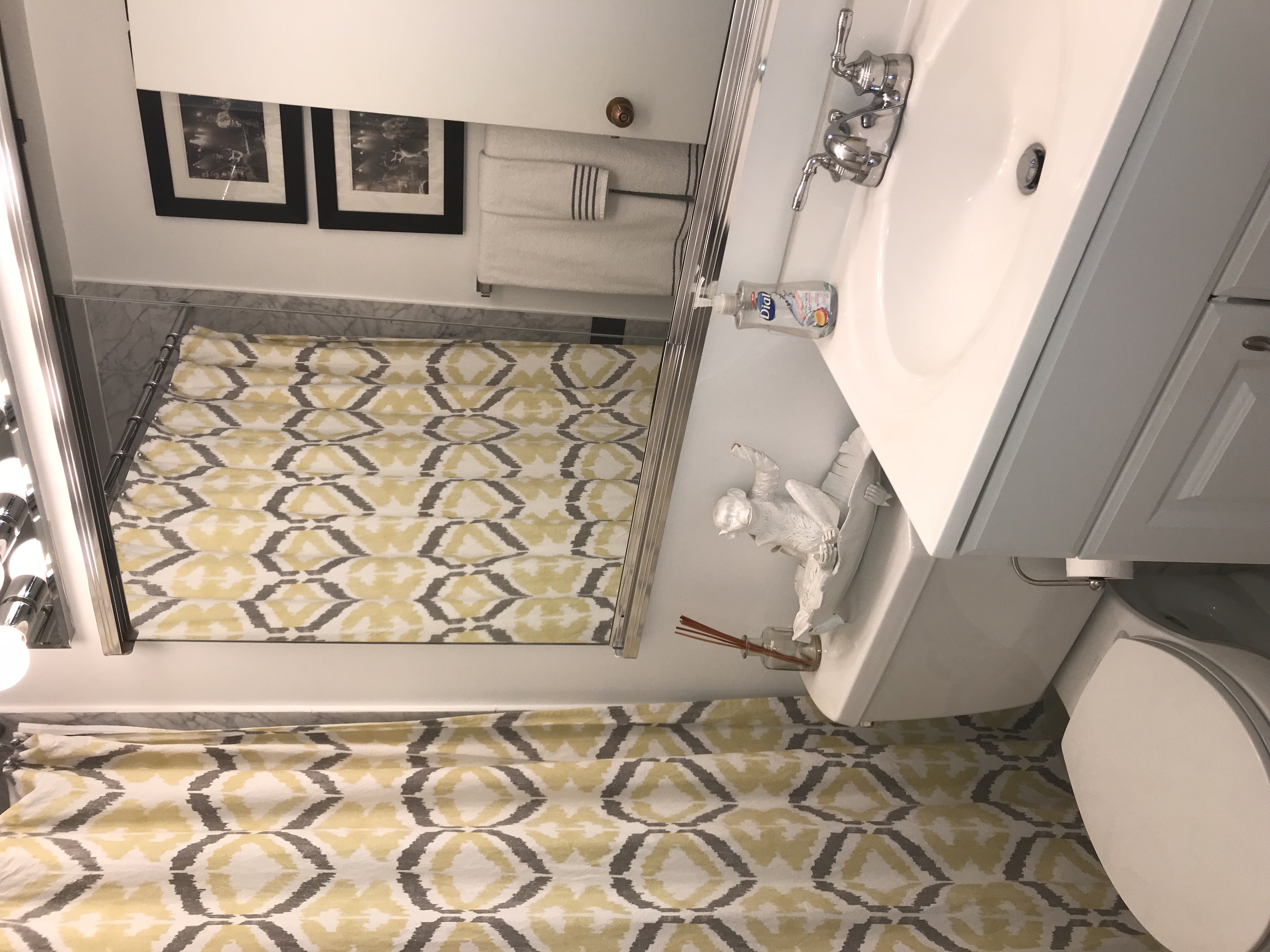 50 Lexington Avenue, Unit 18D Manhattan, NY 10010 - Photo 6 of 12 a bathroom with a sink a toilet and a mirror