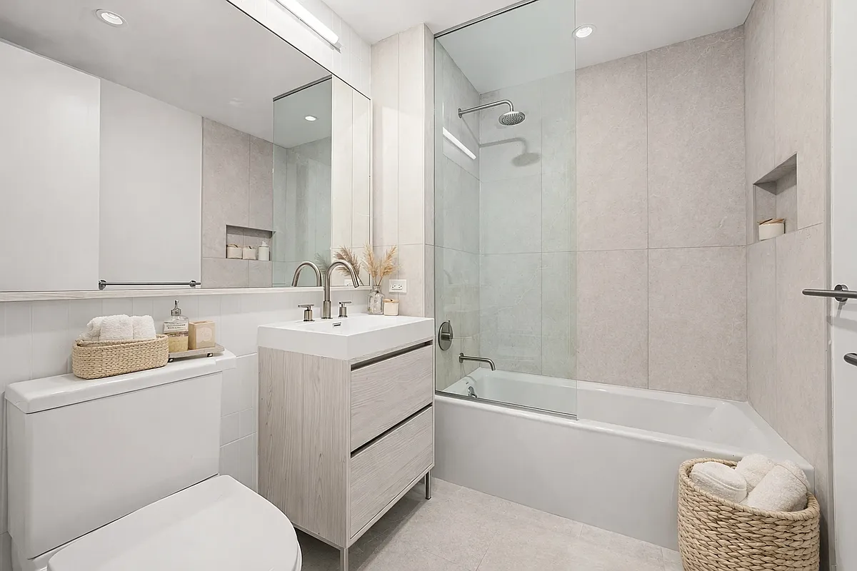 130 2nd Street, Unit 8F Brooklyn, NY 11231 - Photo 5 of 18 a bathroom with a sink a toilet and shower
