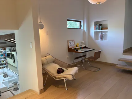 a work room with furniture and wooden floor