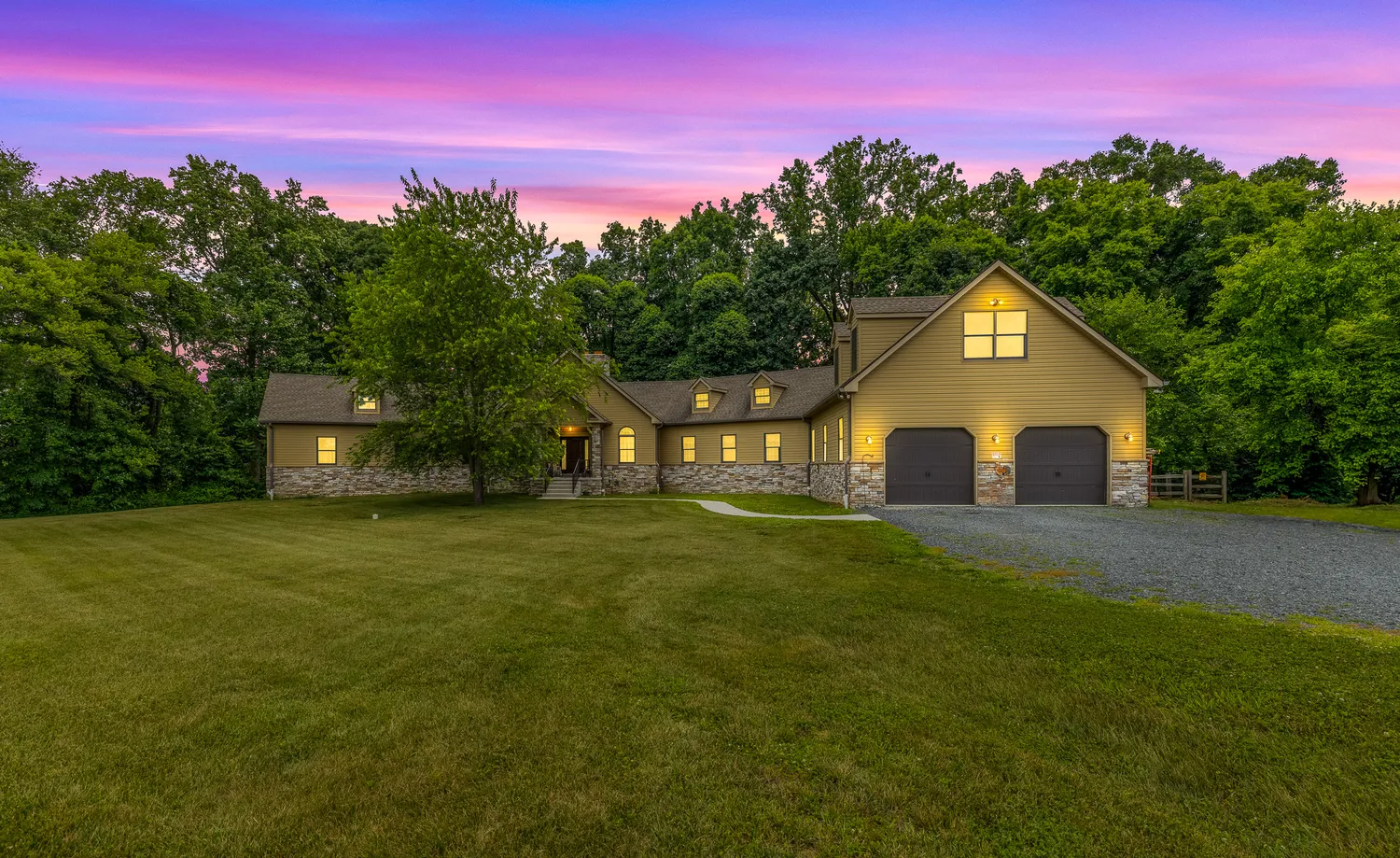 a front view of a house with a yard