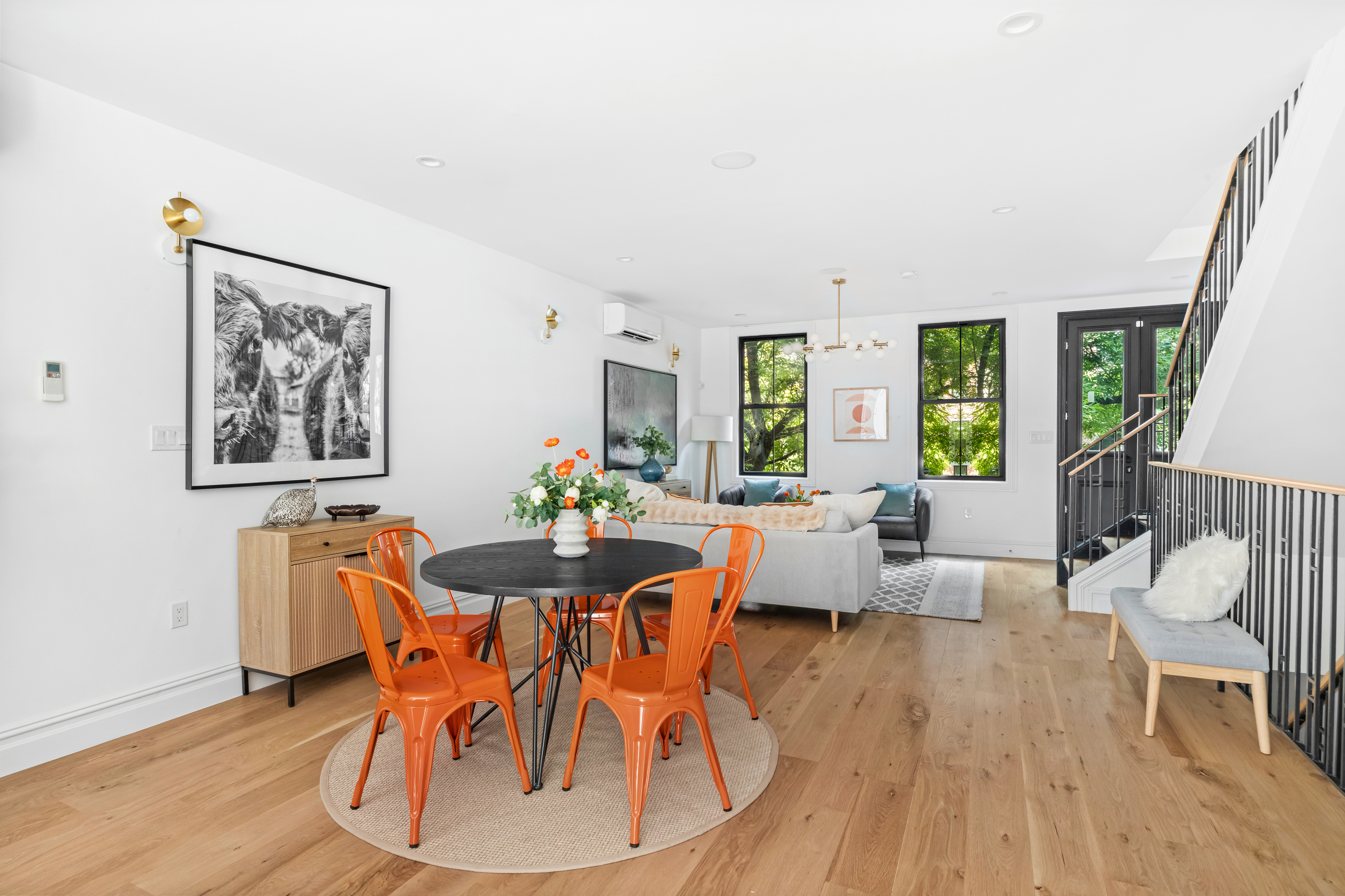 576 Carroll Street, Unit 2 Brooklyn, NY 11215 - Photo 1 of 15 a dining room with wooden floor and large windows