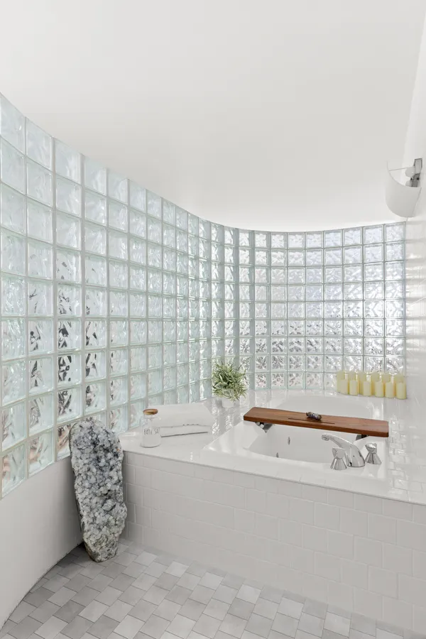 a bathroom with a bathtub and shower