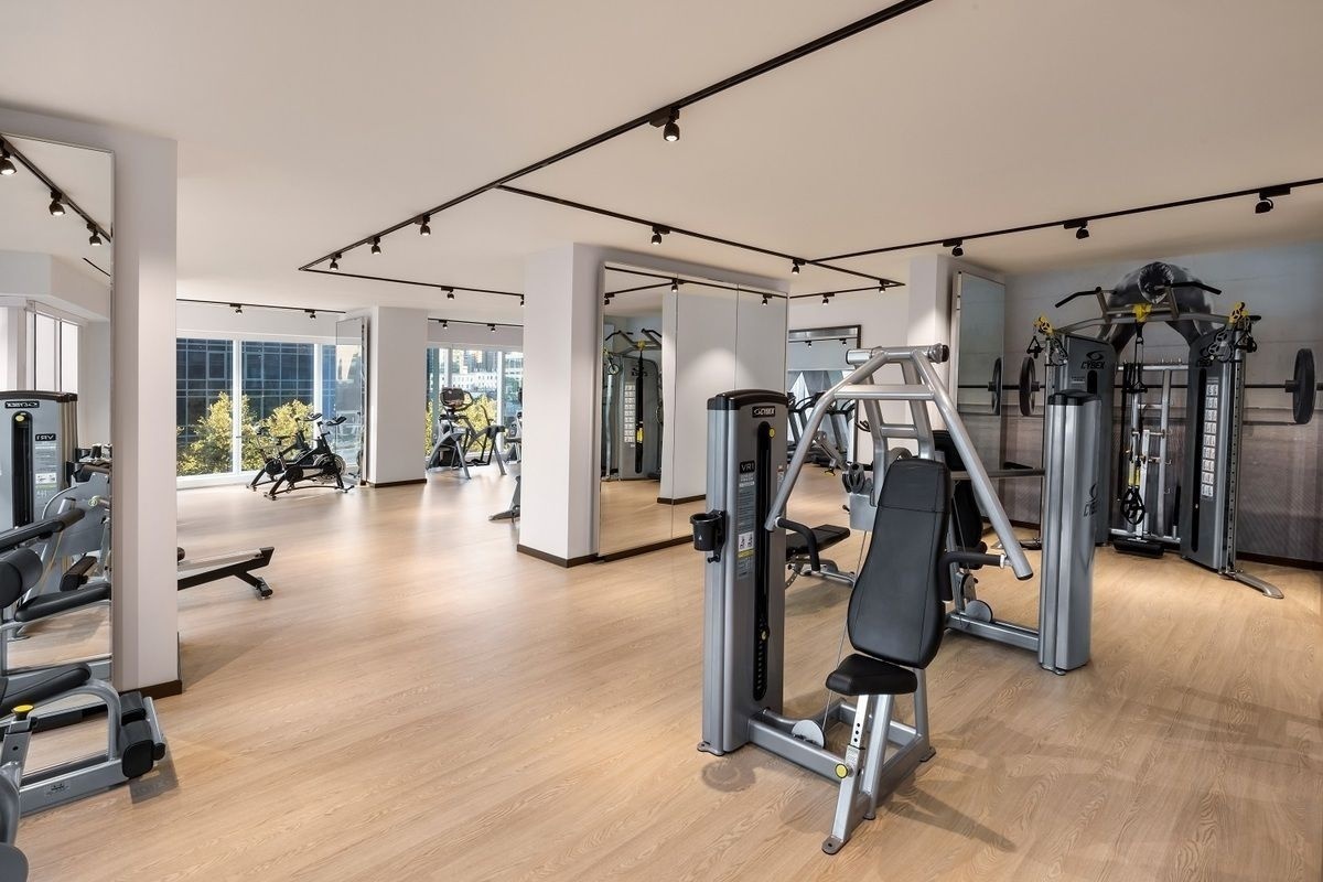 1 West End Avenue, Unit 19J Manhattan, NY 10023 - Photo 17 of 32 a view of a room with gym equipment