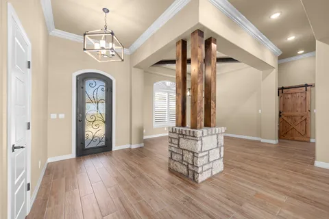 a large kitchen with a table and chairs