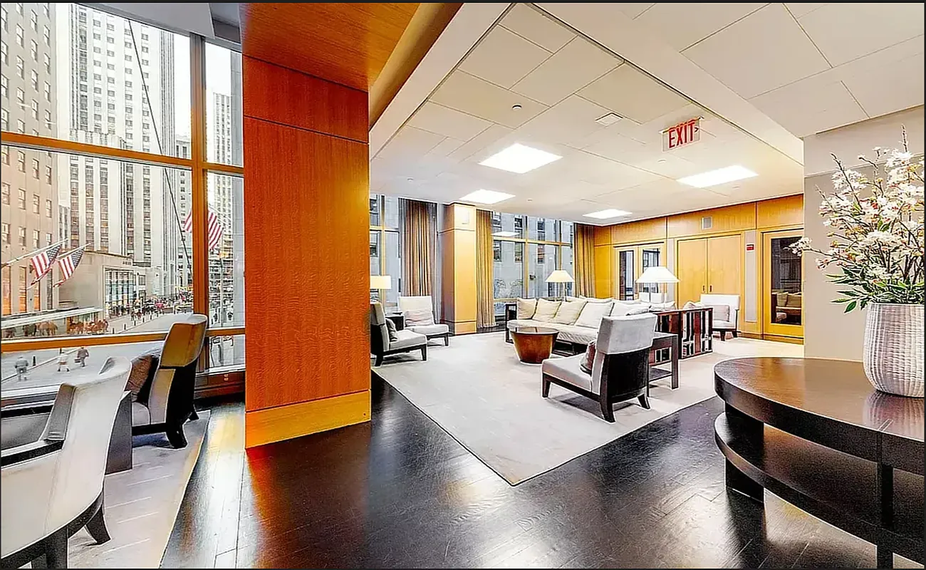18 West 48th Street, Unit 4F Manhattan, NY 10036 - Photo 13 of 20 a living room with furniture and a large window