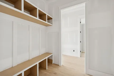 a view of a balcony with wooden floor