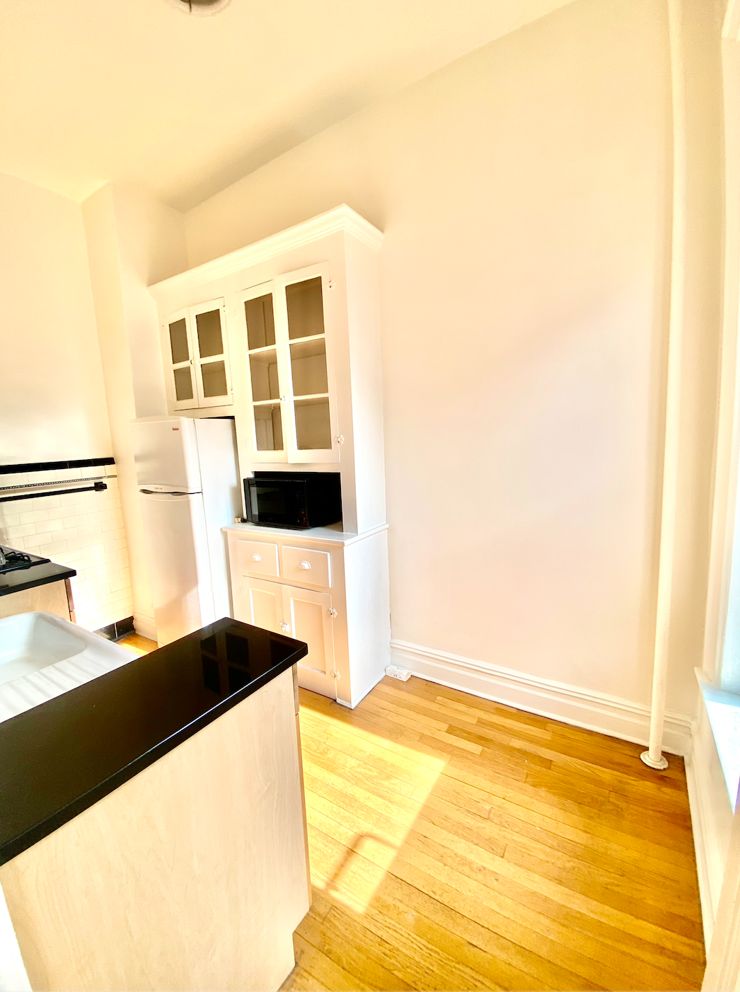 121 7th Avenue, Unit 3R Brooklyn, NY 11215 - Photo 6 of 7 a view of residential kitchen with wooden floor and large windows