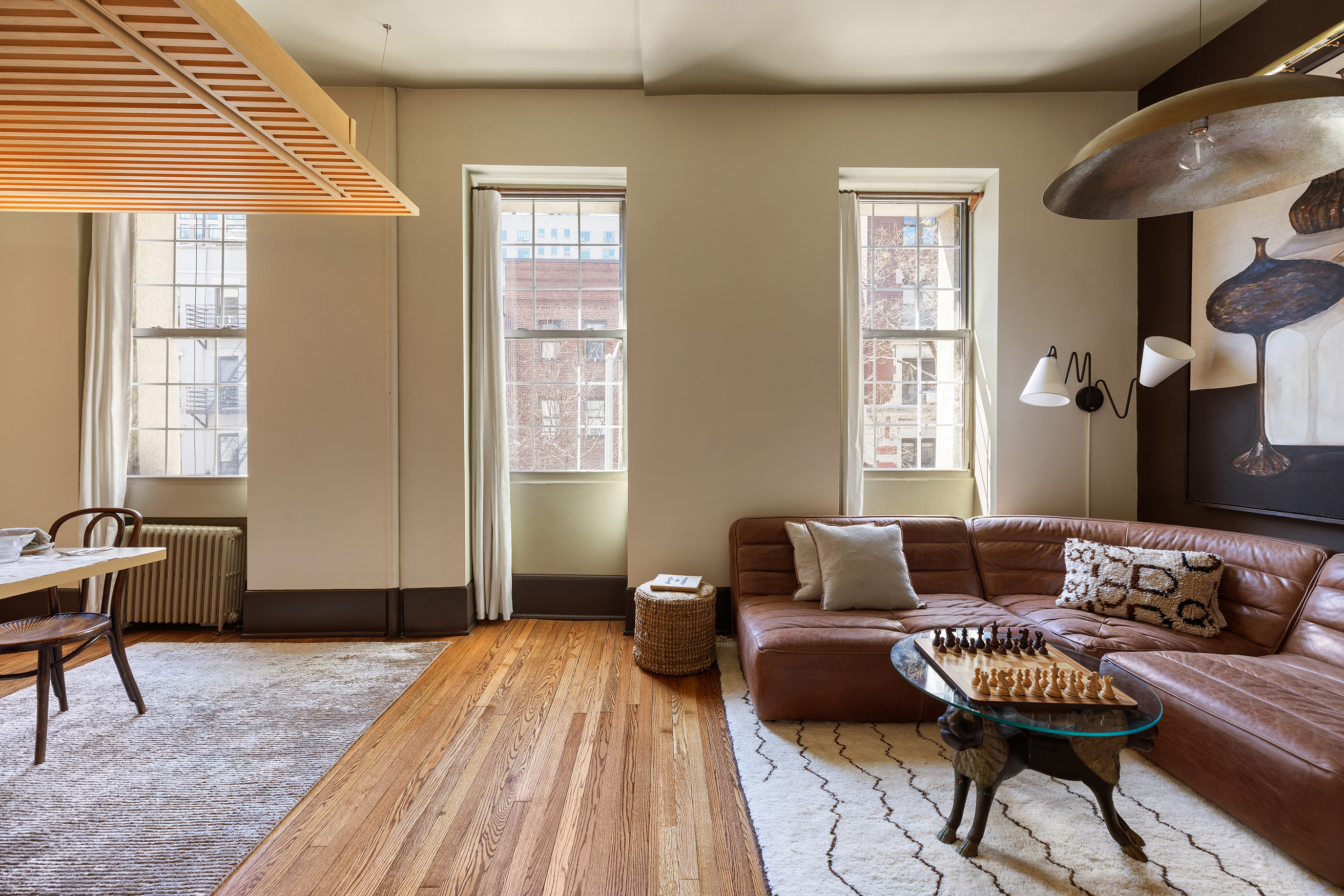 207 West 21st Street, Unit 3F Manhattan, NY 10011 - Photo 2 of 12 a living room with furniture and a window
