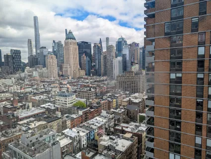 a view of a city with tall buildings