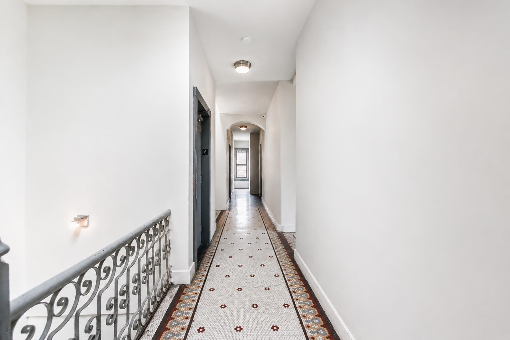 205 West 103rd Street, Unit 6B Manhattan, NY 10025 - Photo 10 of 11 a view of a hallway with wooden floor
