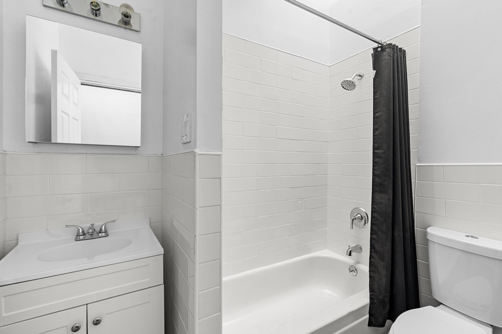 43 Linden Street, Unit 3 Brooklyn, NY 11221 - Photo 5 of 8 a bathroom with a sink a toilet and shower