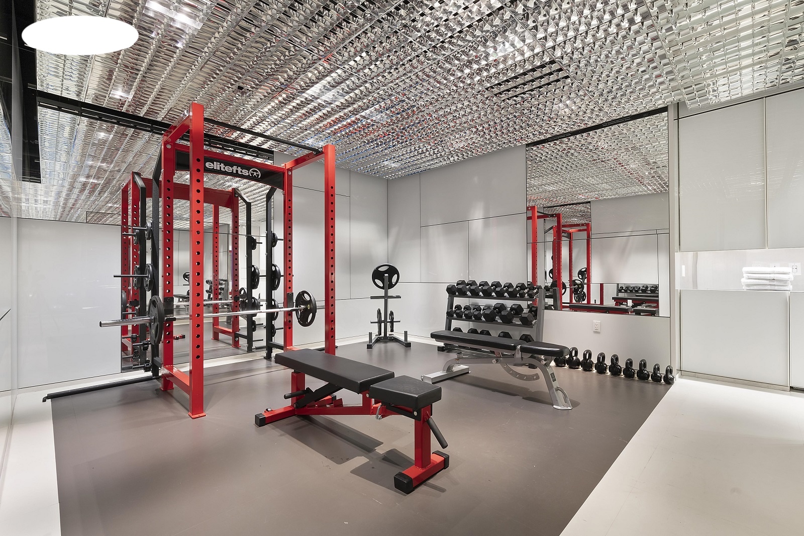 100 11th Avenue, Unit 9D Manhattan, NY 10011 - Photo 10 of 17 a gym room with gym equipment