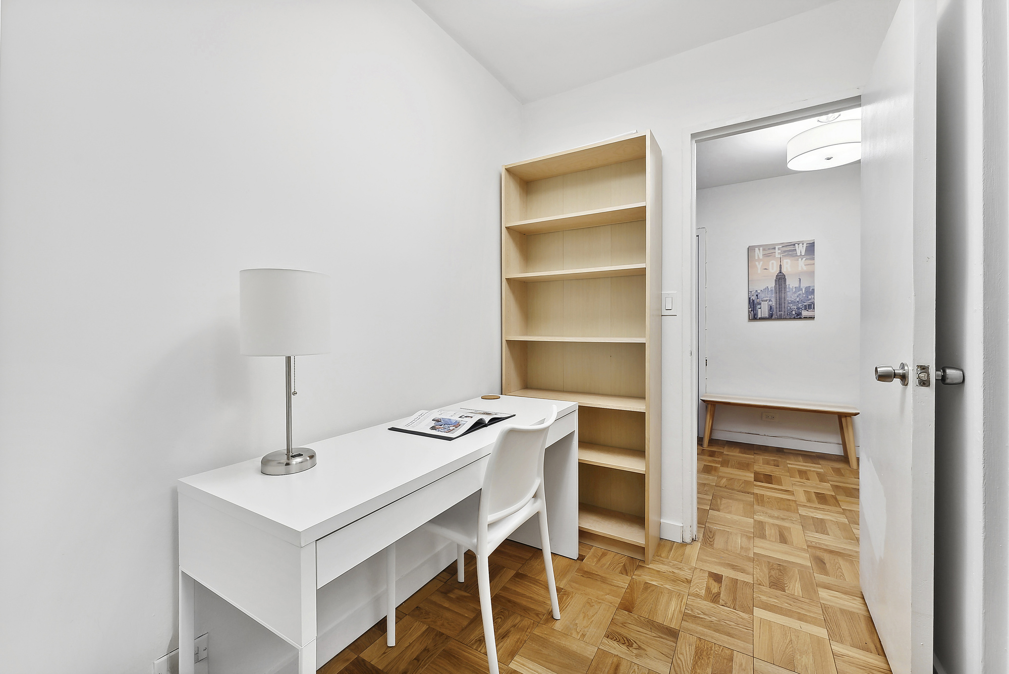 2 5th Avenue, Unit 2U Manhattan, NY 10011 - Photo 4 of 13 a view of a workspace with furniture