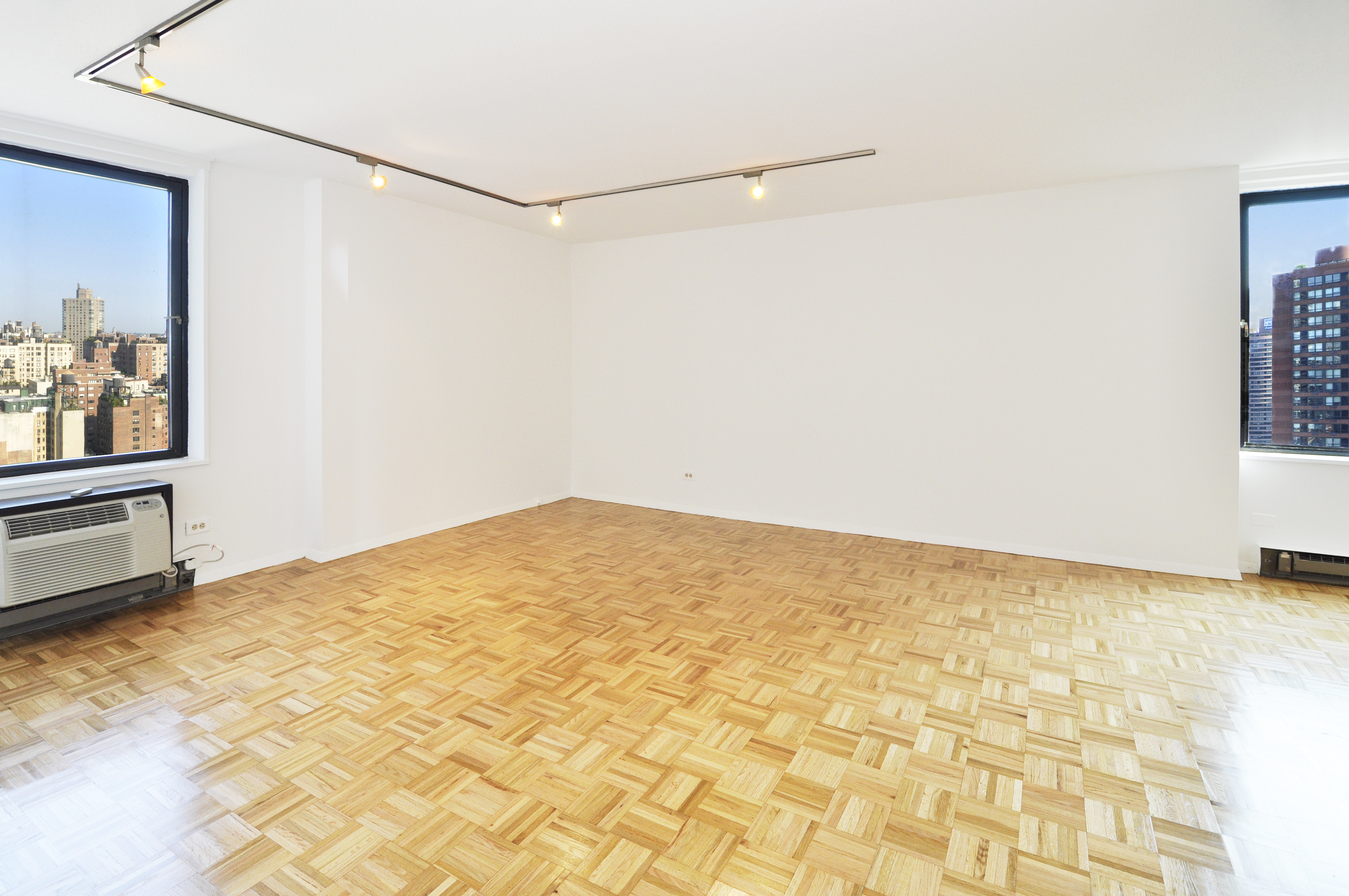 1623 3rd Avenue, Unit 25C Manhattan, NY 10128 - Photo 8 of 12 a view of a room with a empty space and cabinet