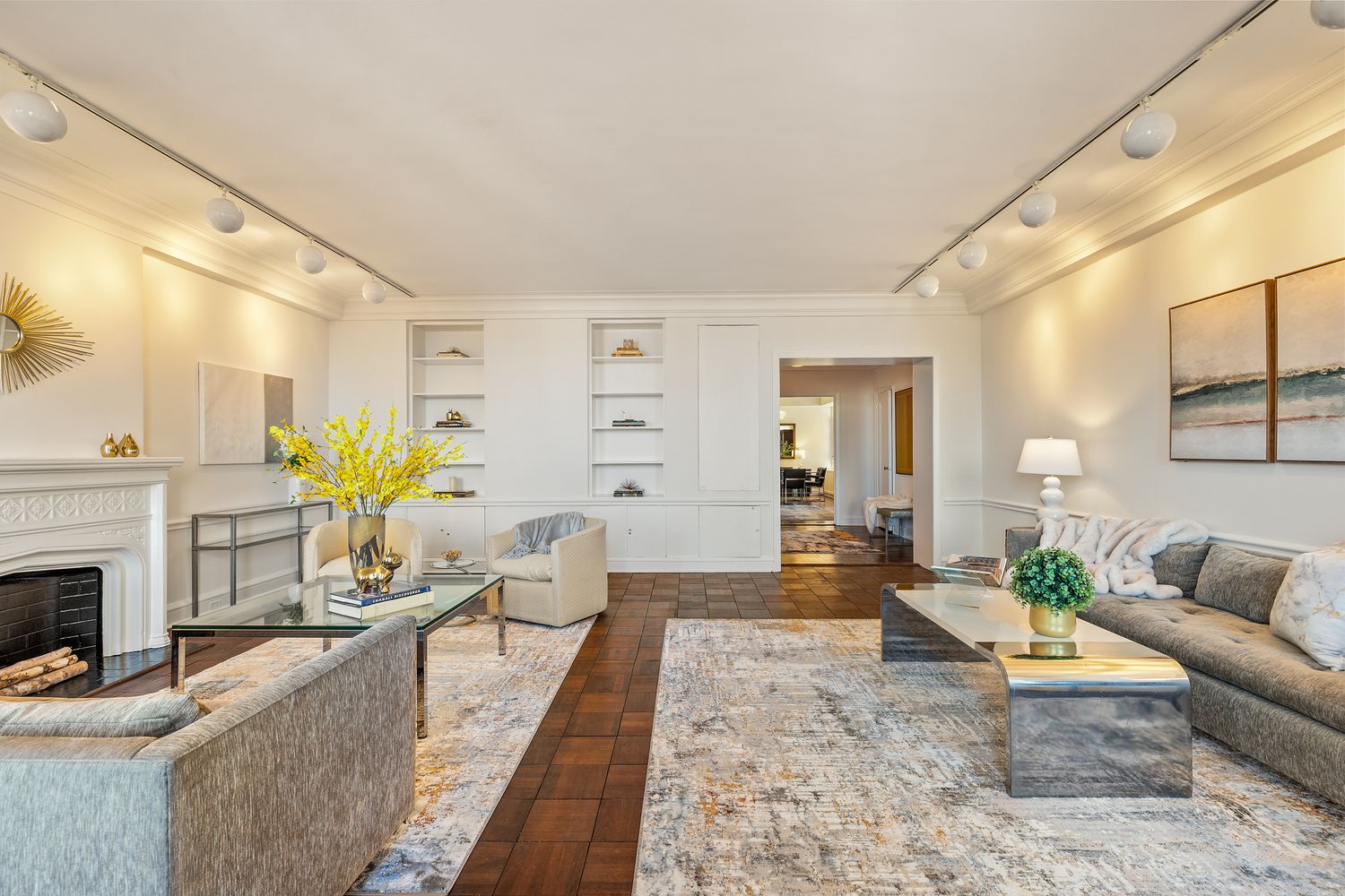 a living room with furniture potted plant and a fireplace