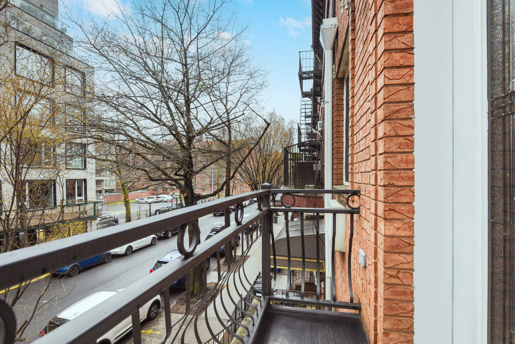 585 Warren Street, Unit 2 Brooklyn, NY 11217 - Photo 12 of 12 a view of wooden balcony and trees