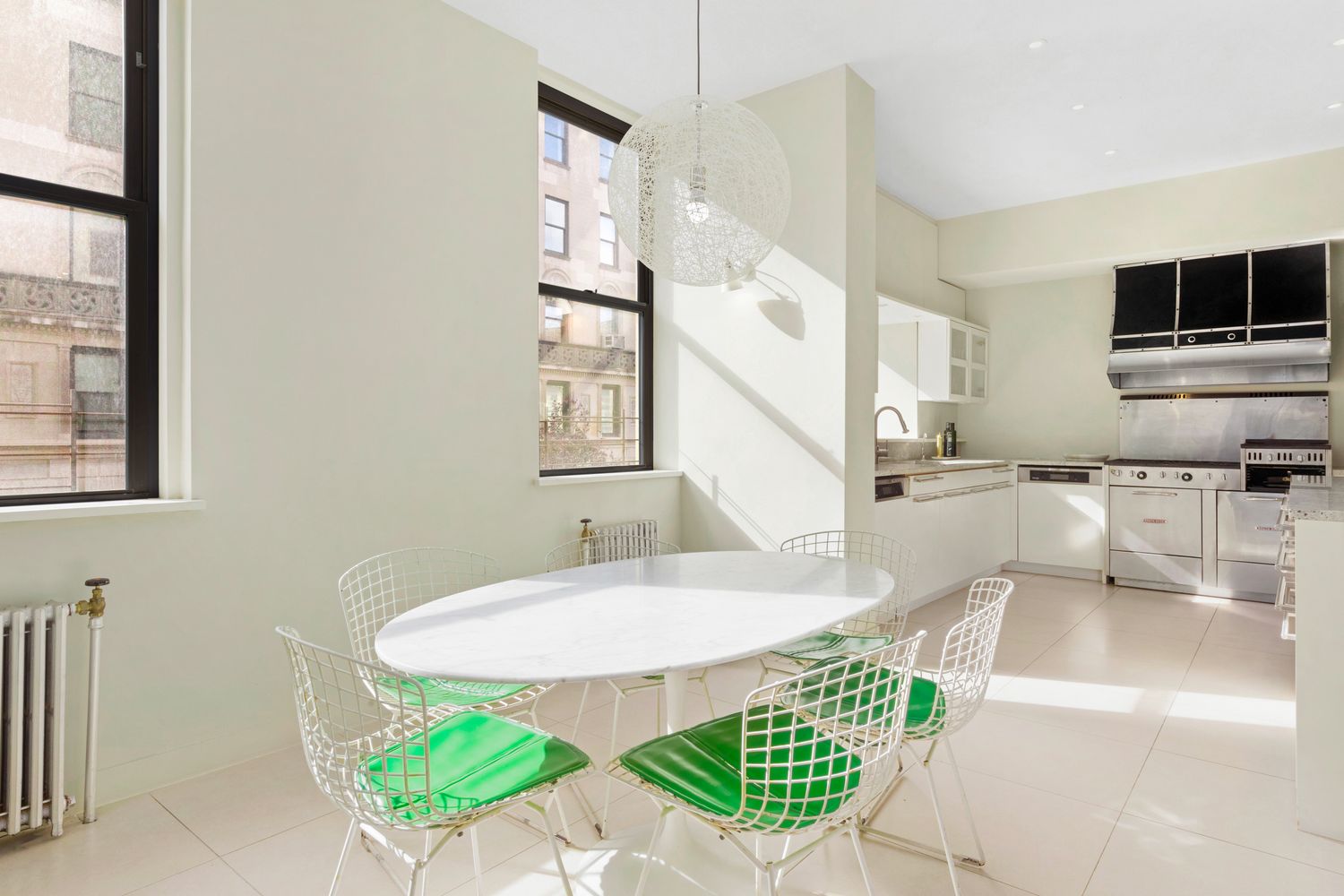 a dining room with furniture and a window