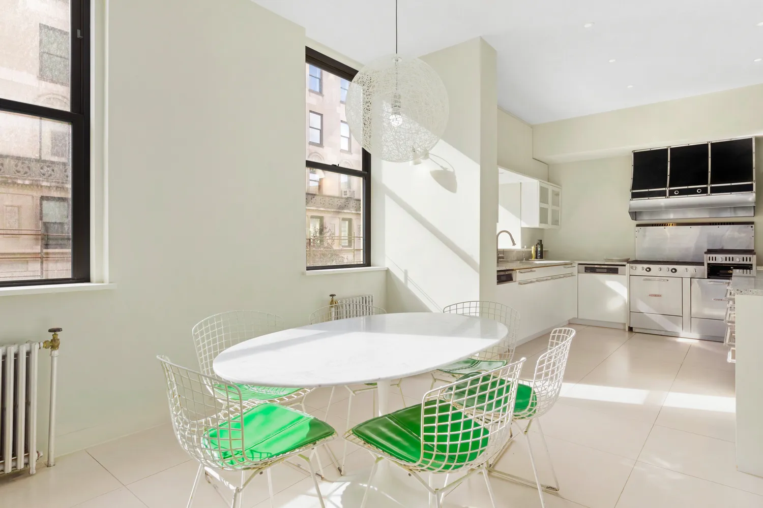 a dining room with furniture and a window