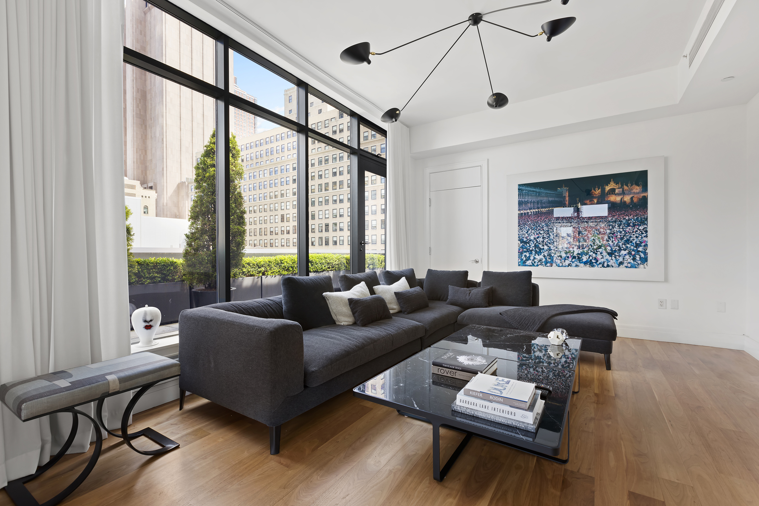 34 Leonard Street, Unit PH Manhattan, NY 10013 - Photo 6 of 30 a living room with furniture and a large window