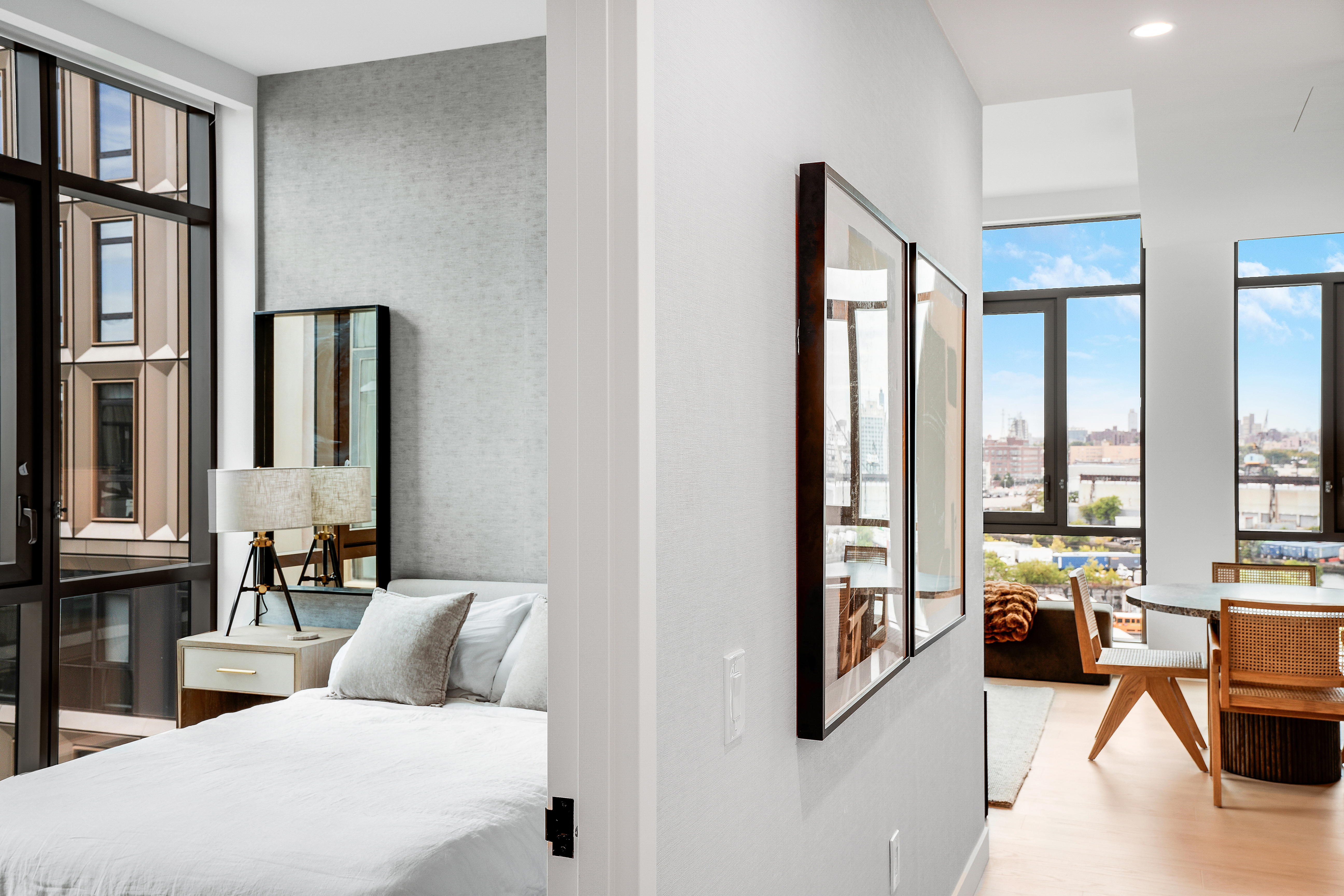 480 Kent Avenue, Unit 9A Brooklyn, NY 11249 - Photo 7 of 33 a bedroom with furniture and large windows