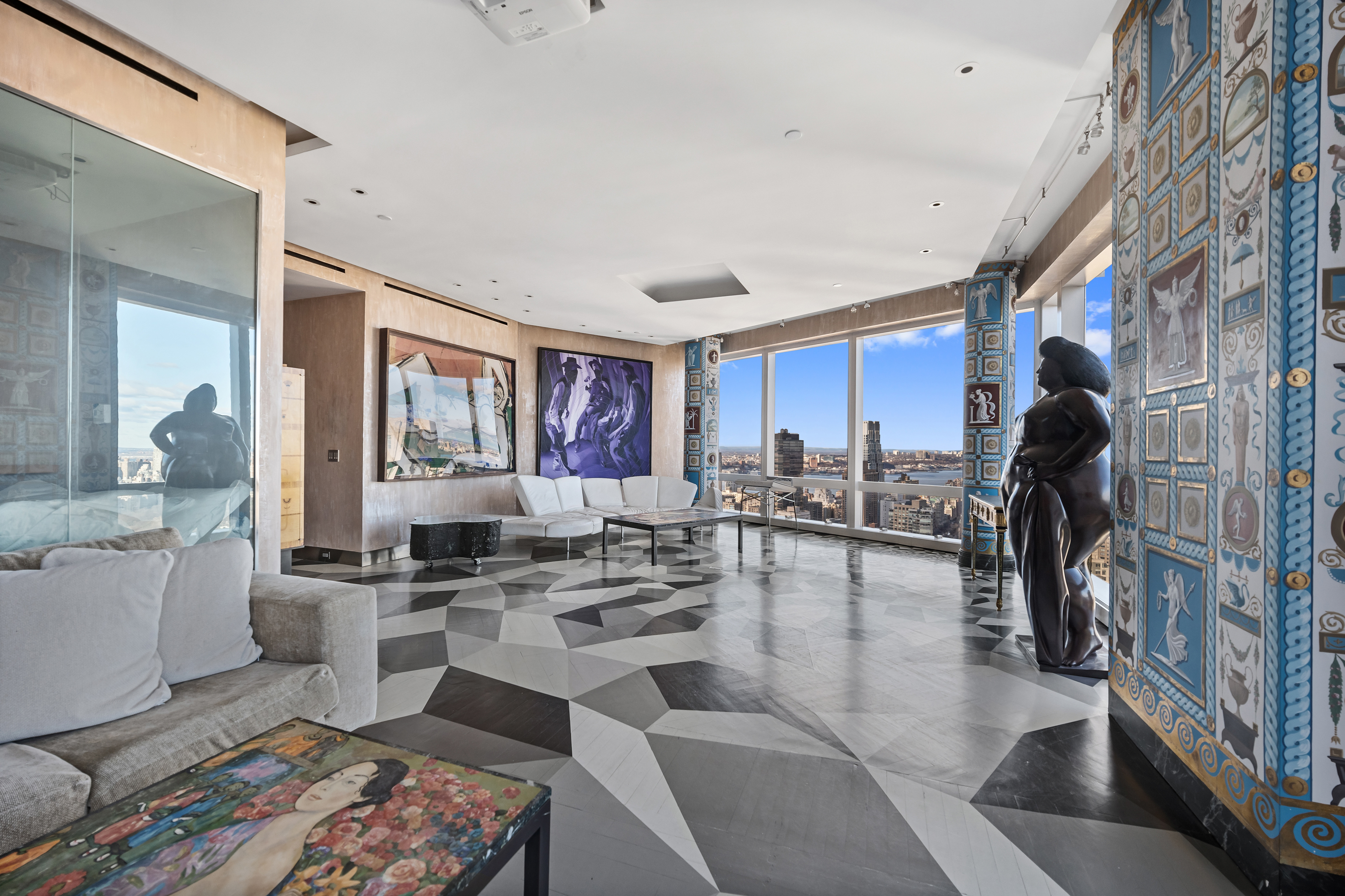 80 Columbus Circle, Unit 67B Manhattan, NY 10019 - Photo 3 of 16 a living room with lots of furniture and a view of kitchen