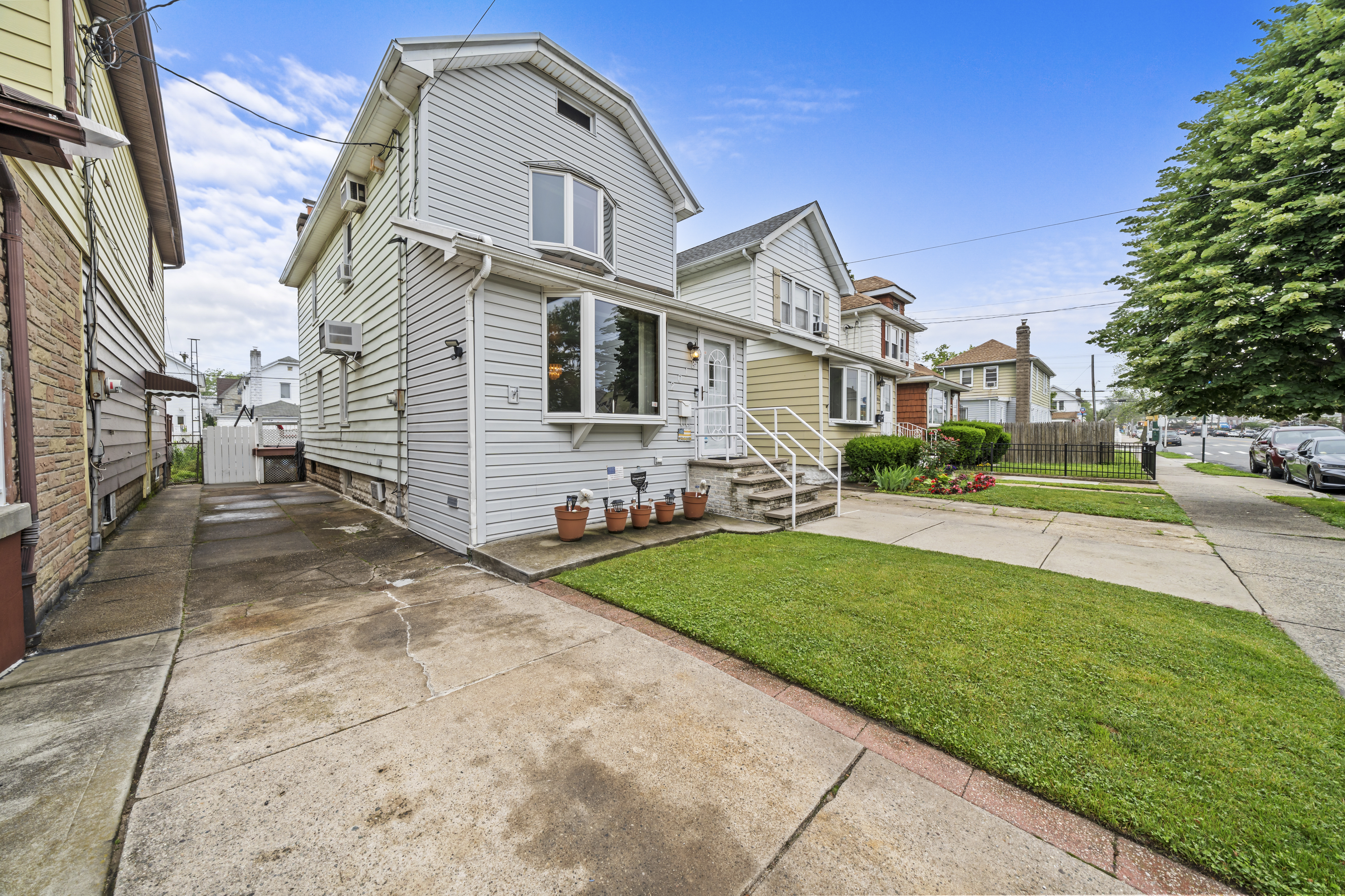 2018 Mill Avenue Brooklyn, NY 11234 - Photo 3 of 20 a front view of a house with a yard