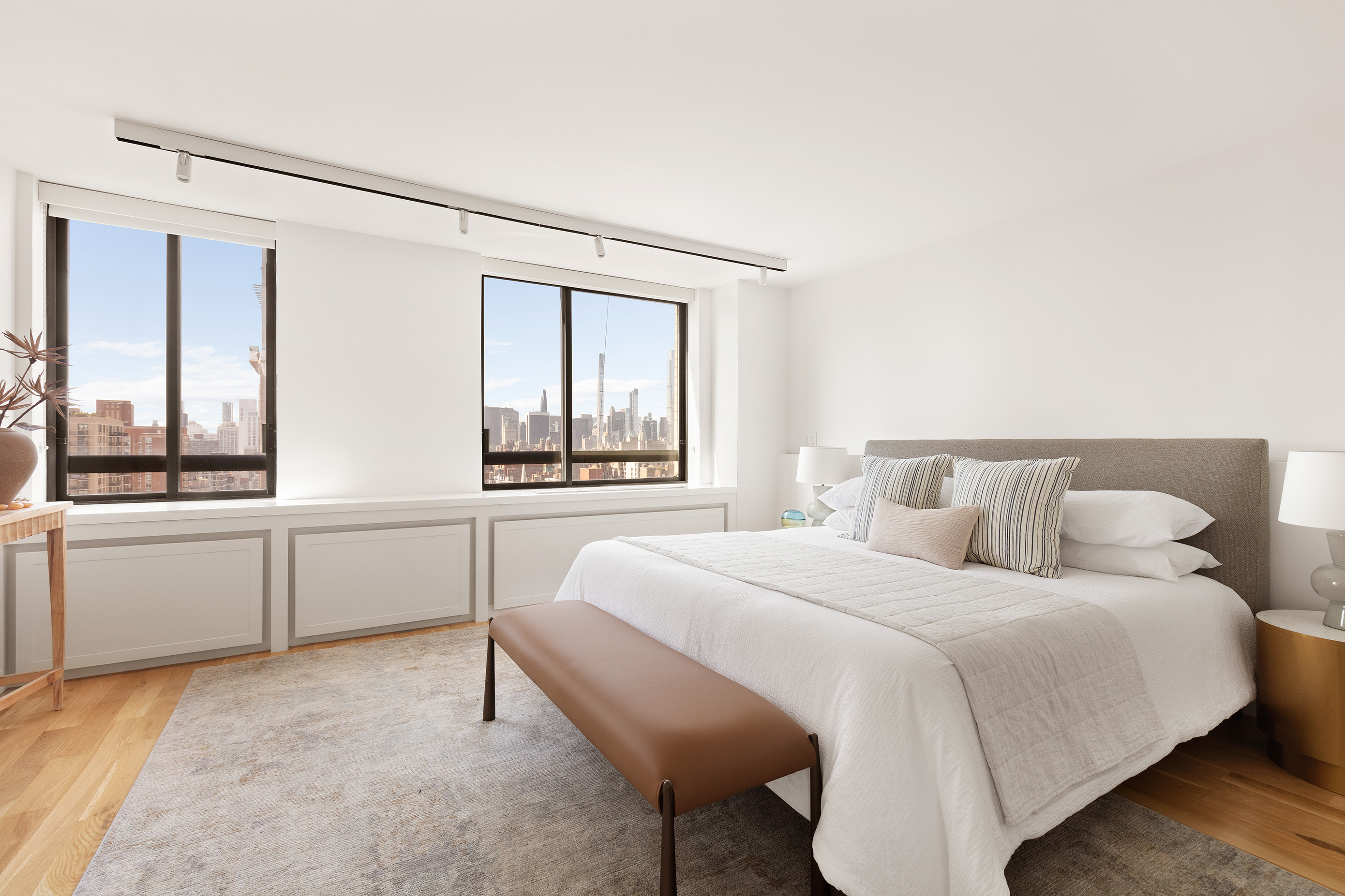 171 East 84th Street, Unit 25B/C Manhattan, NY 10028 - Photo 11 of 13 a bedroom with a bed and a large window