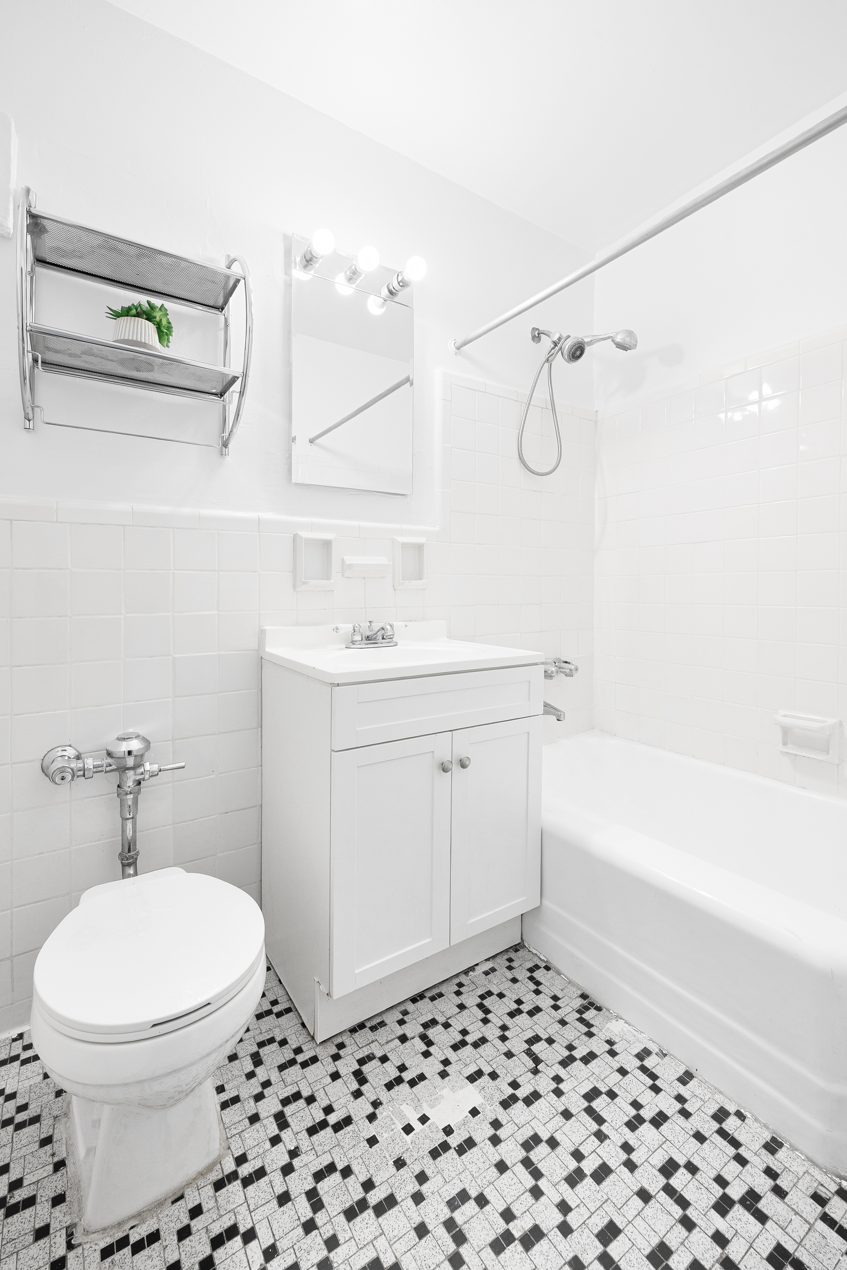 50-21 39th Place, Unit 6D Queens, NY 11104 - Photo 12 of 15 a bathroom with a sink a toilet and shower