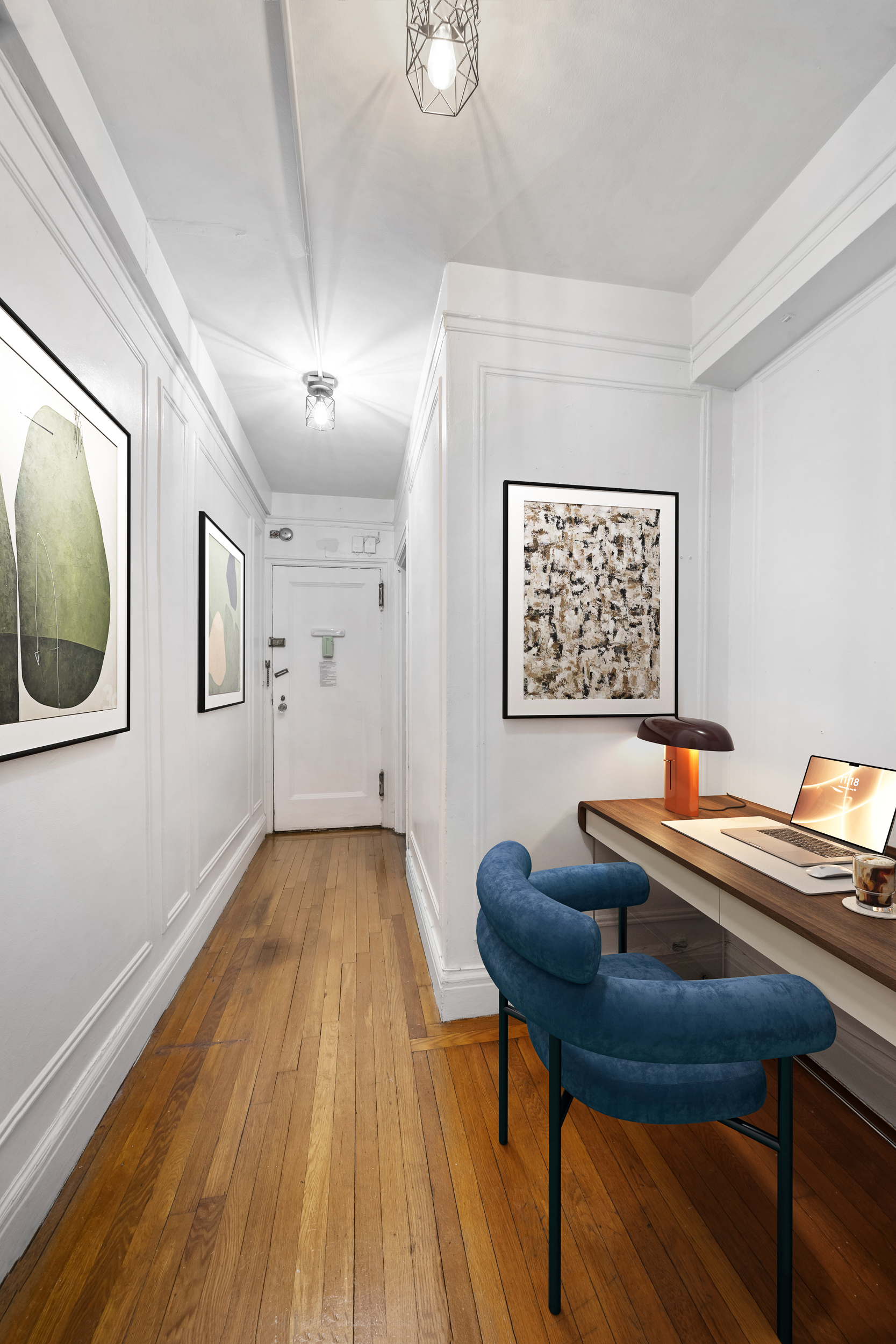 325 West 45th Street, Unit 205 Manhattan, NY 10036 - Photo 4 of 14 a workspace with furniture and wooden floor