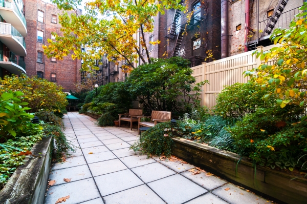 2250 Broadway, Unit 6K Manhattan, NY 10024 - Photo 14 of 15 a view of a chair and tables in the backyard of a house