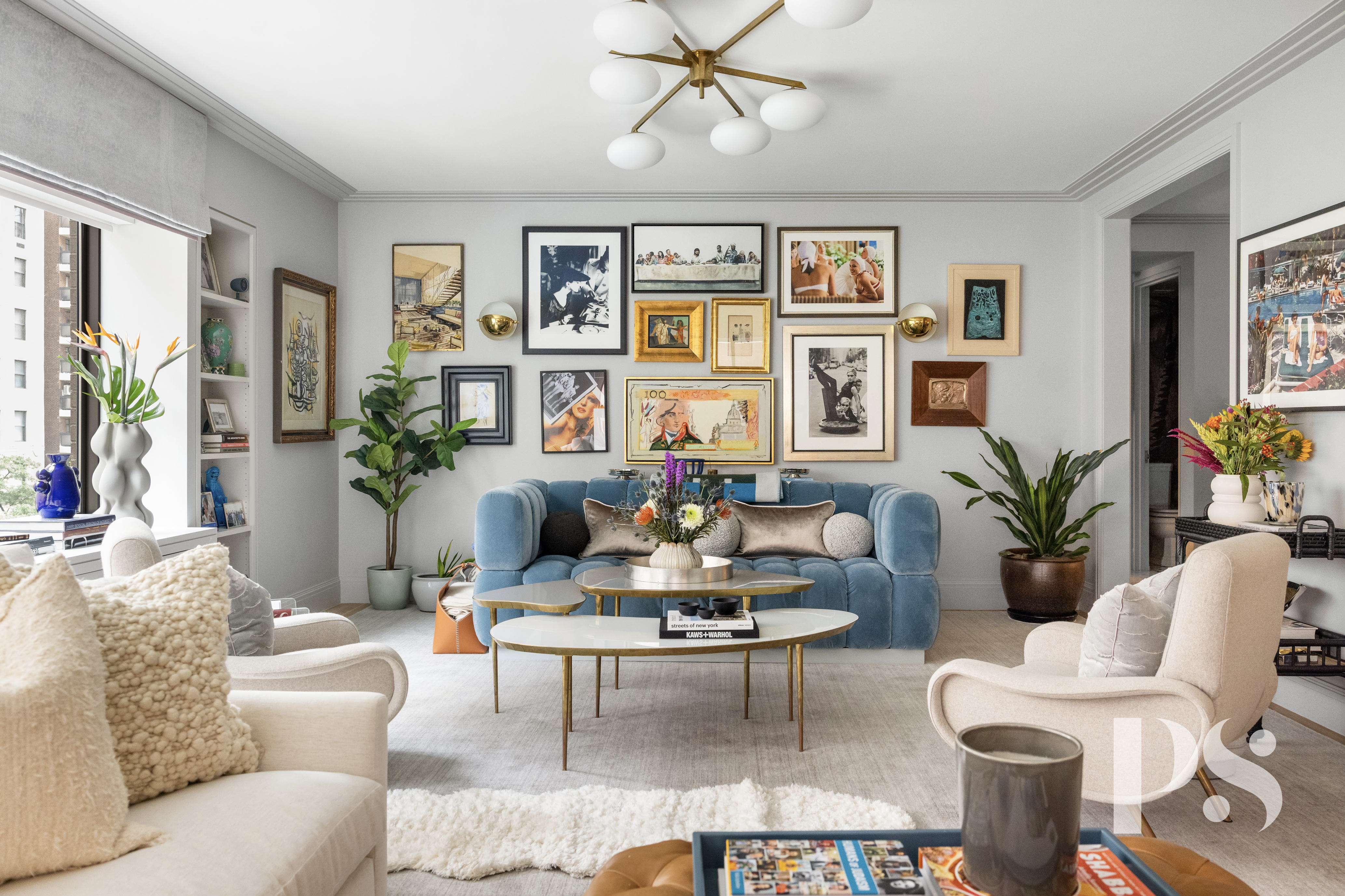 a living room with furniture potted plant and window