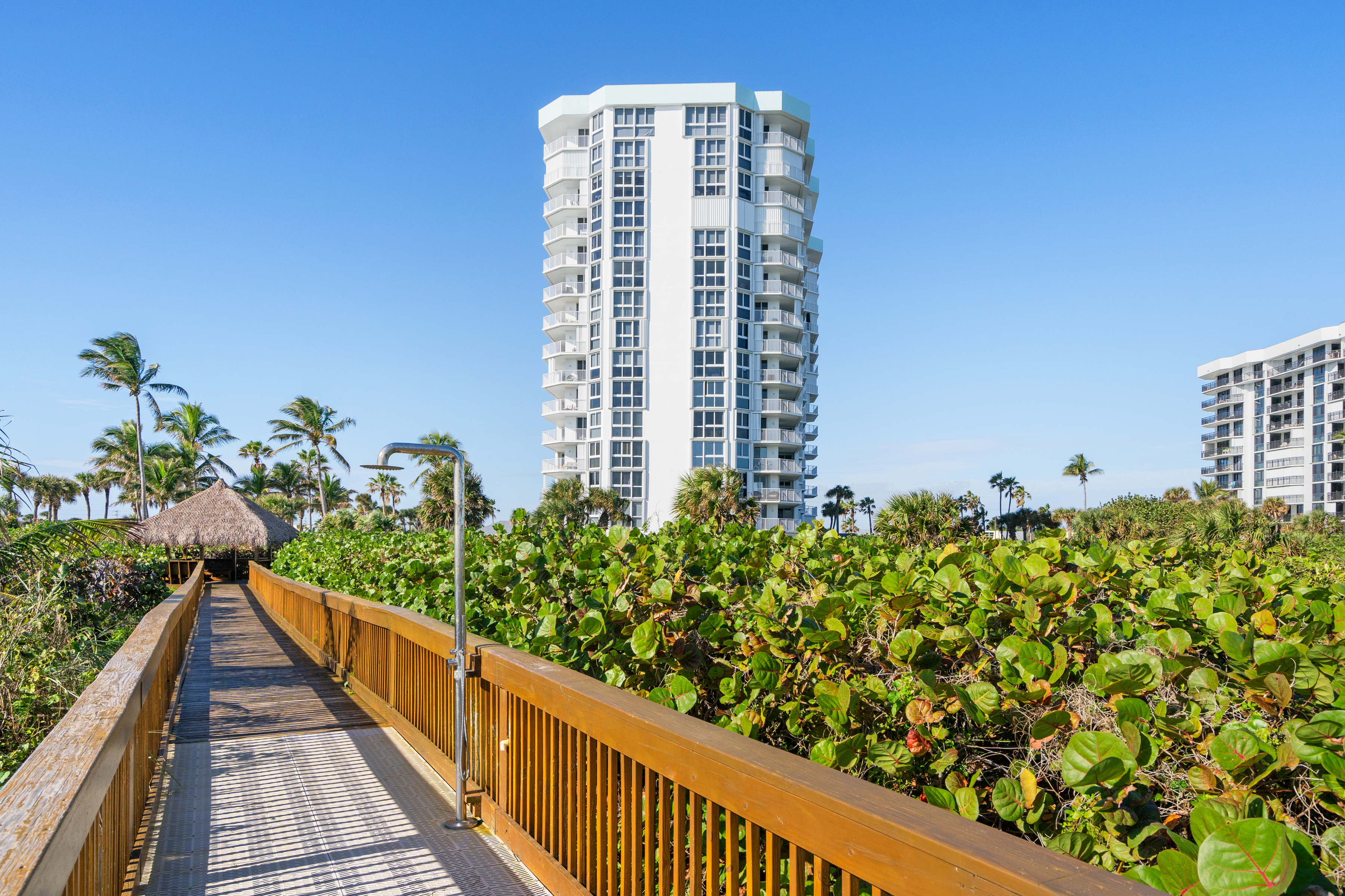 2700 North Highway A1a, Unit 207 Fort Pierce, FL 34949 - Photo 34 of 36 a view of a balcony with wooden floor and plants