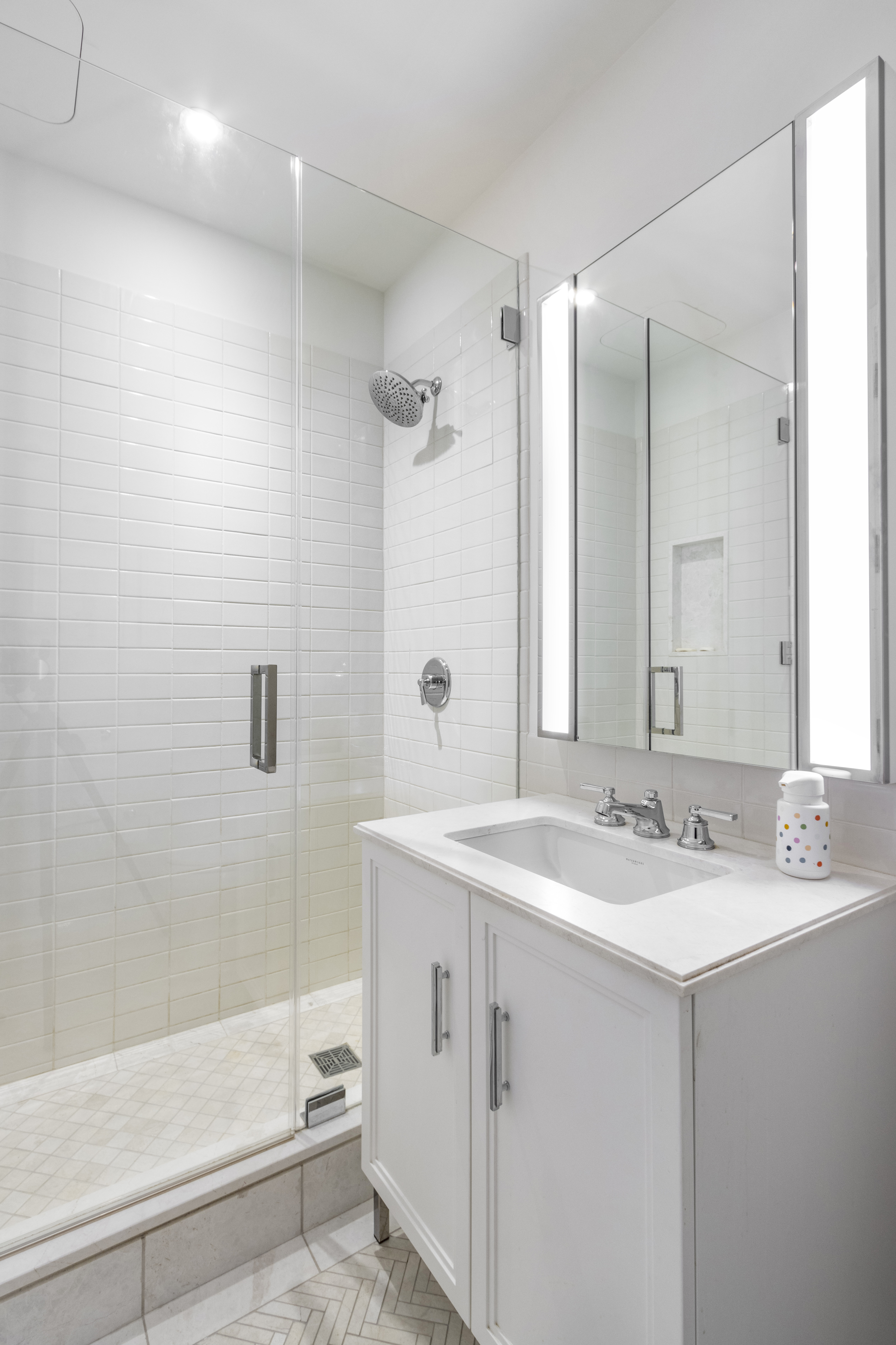 100 Barclay Street, Unit 13K Manhattan, NY 10007 - Photo 14 of 27 a bathroom with a sink double vanity mirror and a bathtub