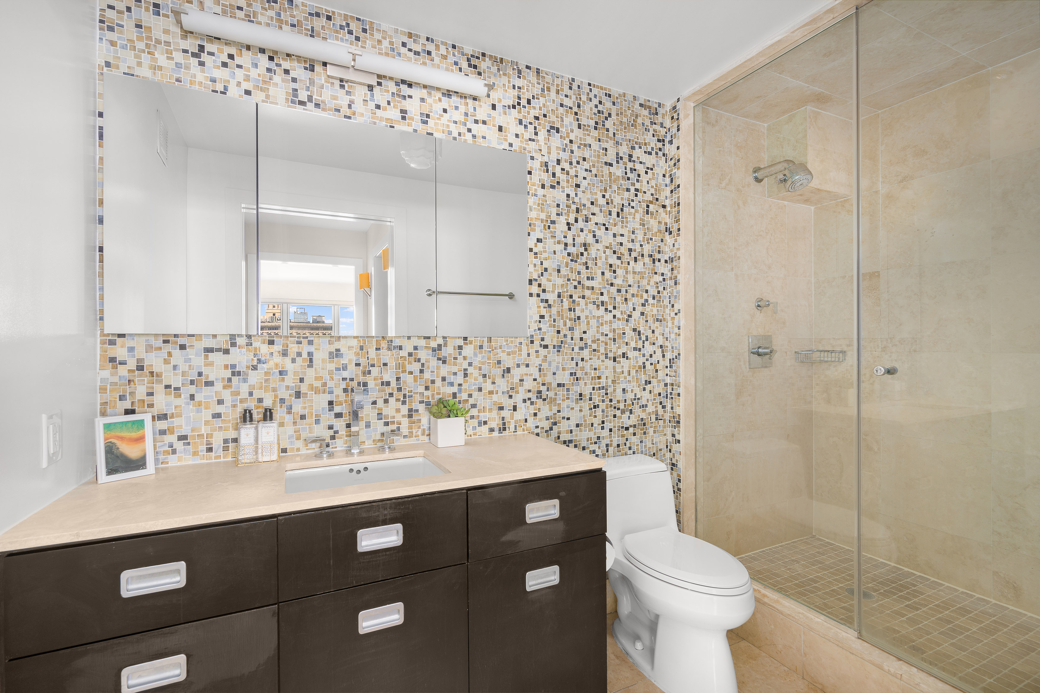 20 East 9th Street, Unit 22C Manhattan, NY 10003 - Photo 7 of 21 a bathroom with a sink toilet and shower