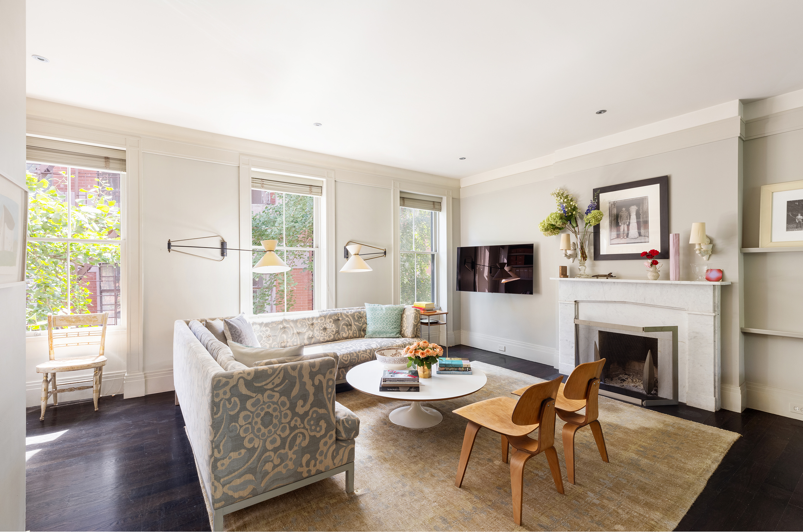 25 Perry Street Manhattan, NY 10014 - Photo 11 of 32 a living room with furniture a flat screen tv and a fireplace
