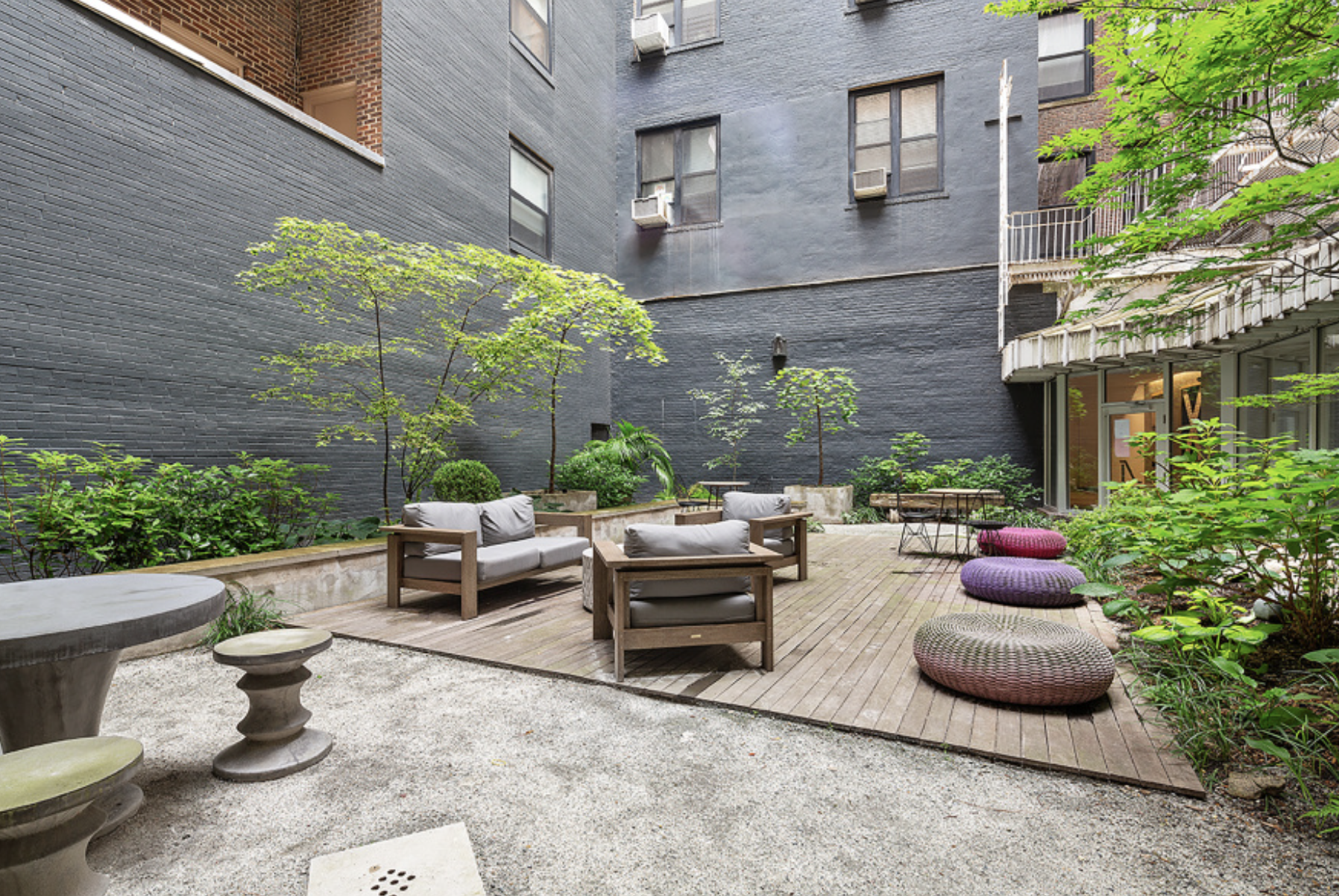 250 Mercer Street, Unit C302 Manhattan, NY 10012 - Photo 18 of 24 a view of a patio with couches table and chairs and potted plants