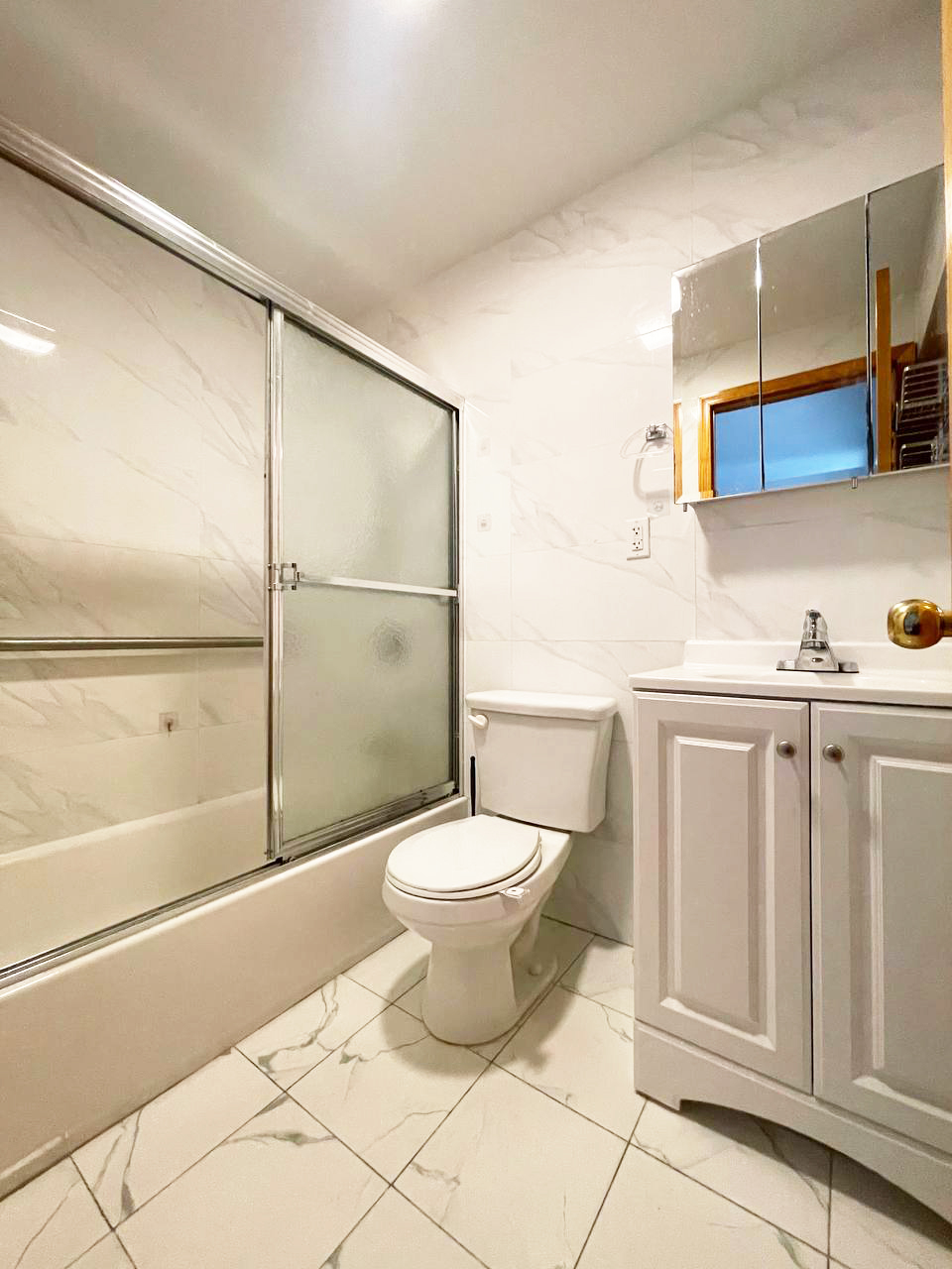 5815 6th Avenue, Unit 3B Brooklyn, NY 11220 - Photo 5 of 6 a bathroom with a toilet and a shower