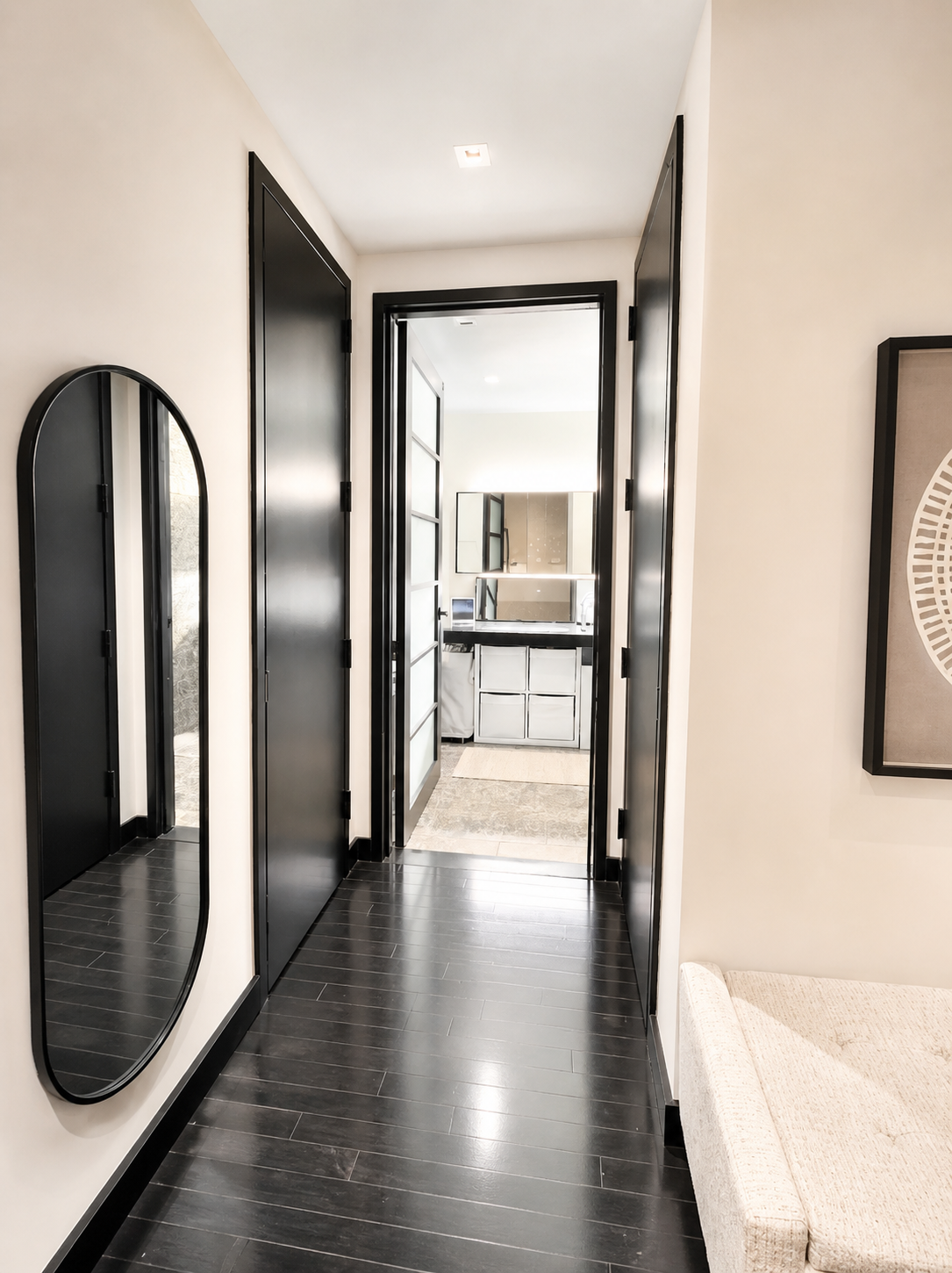 20 Pine Street, Unit 1415 Manhattan, NY 10005 - Photo 4 of 8 a view of a hallway with wooden floor and a bathroom