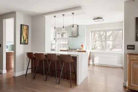 a dining room with a window table and chairs