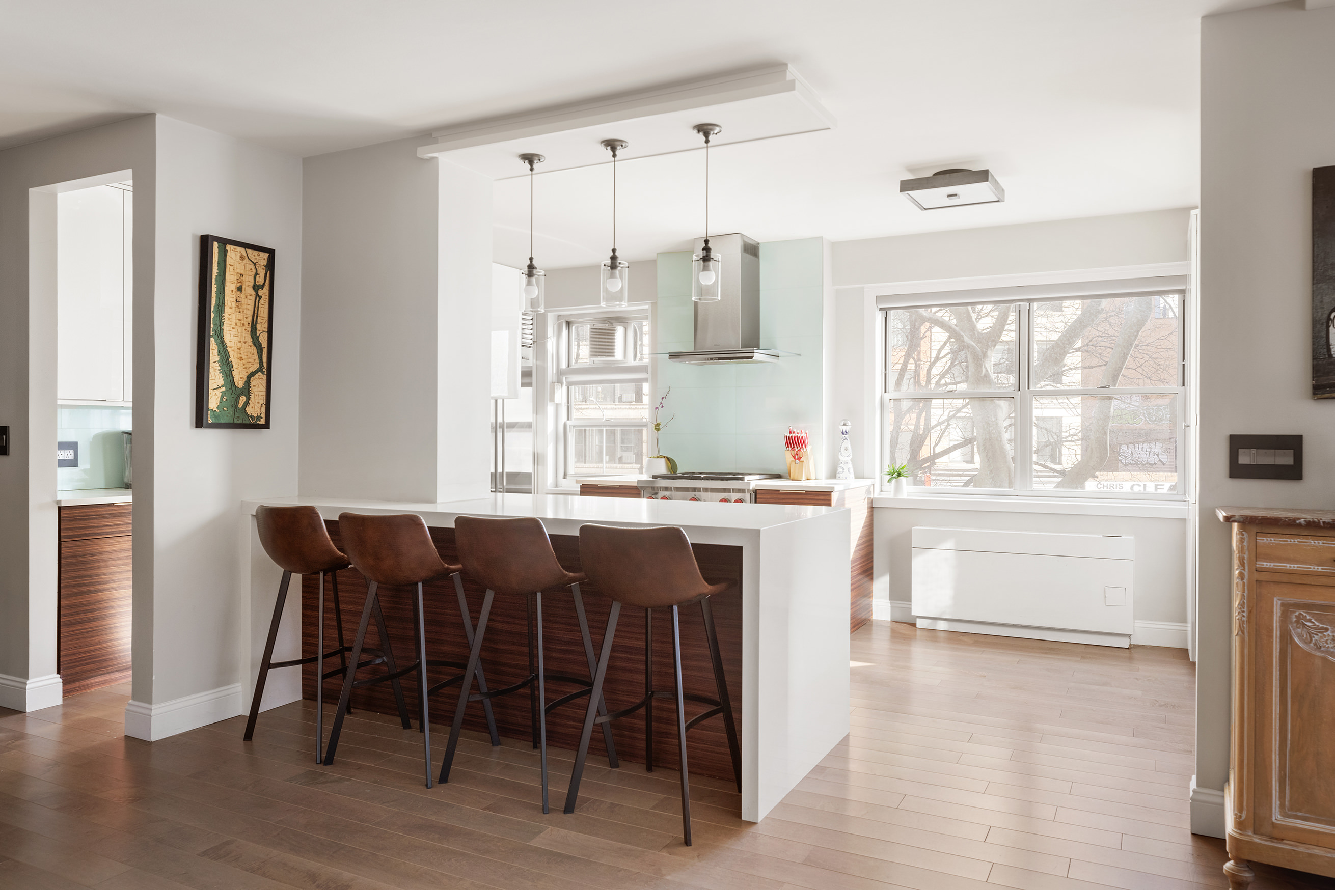 70 East 10th Street, Unit 3B Manhattan, NY 10003 - Photo 2 of 11 a dining room with a window table and chairs