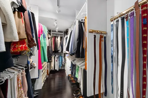 a view of walk in closet with clothes