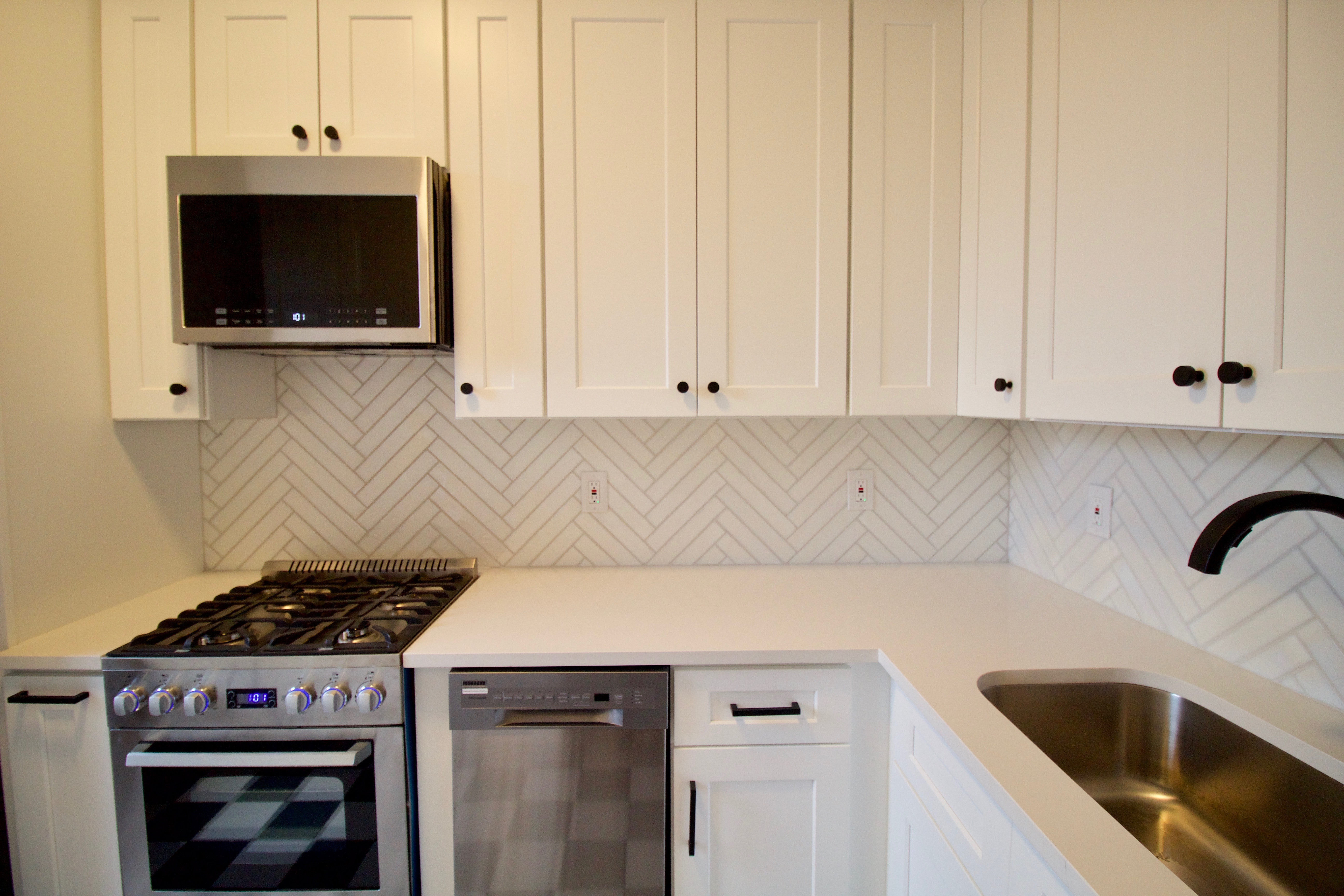 403 Caton Avenue, Unit 3 Brooklyn, NY 11218 - Photo 7 of 31 a kitchen with a stove and a microwave
