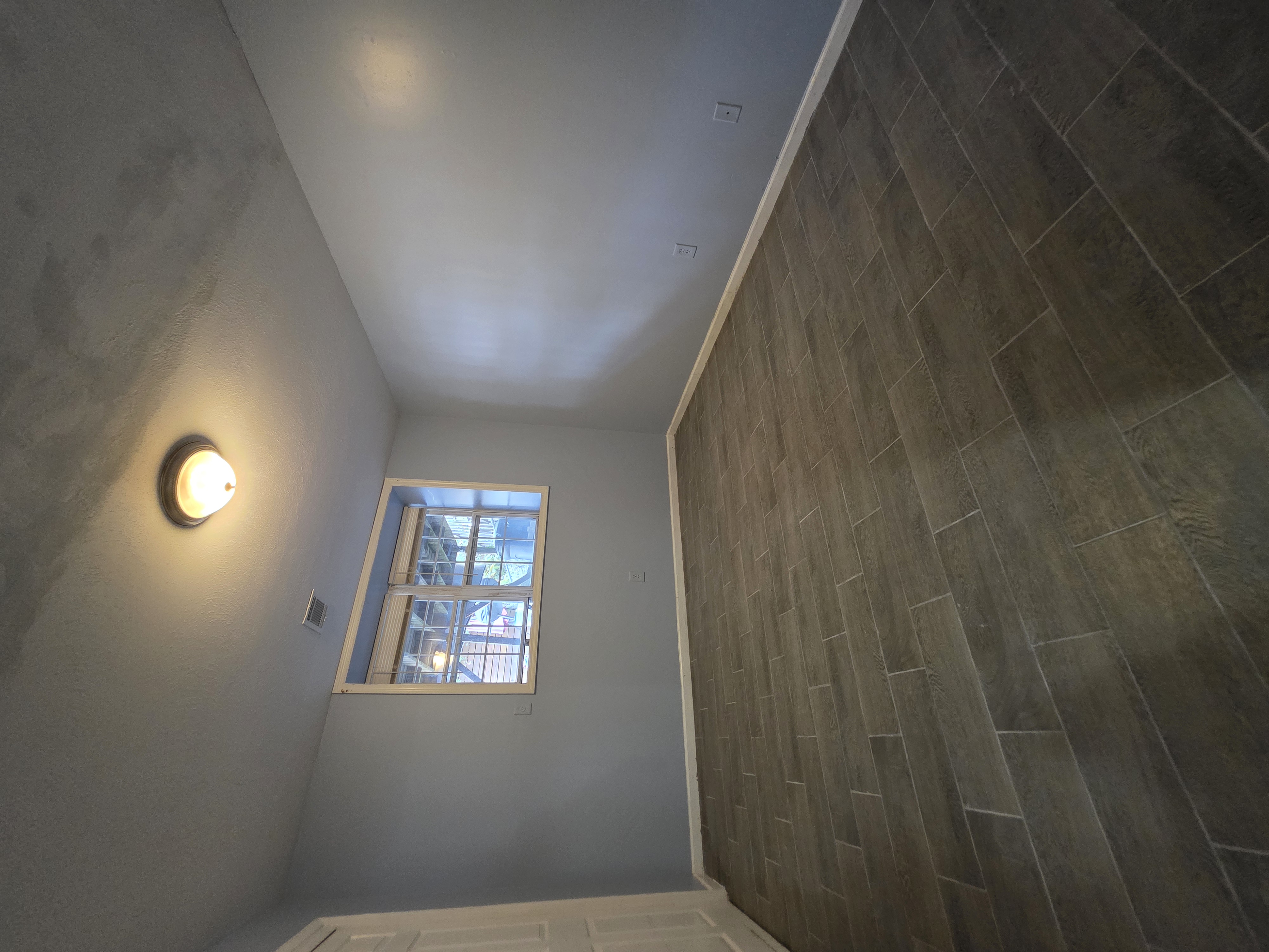 216 Pond Way, Unit 1 Staten Island, NY 10303 - Photo 9 of 9 an empty room with windows