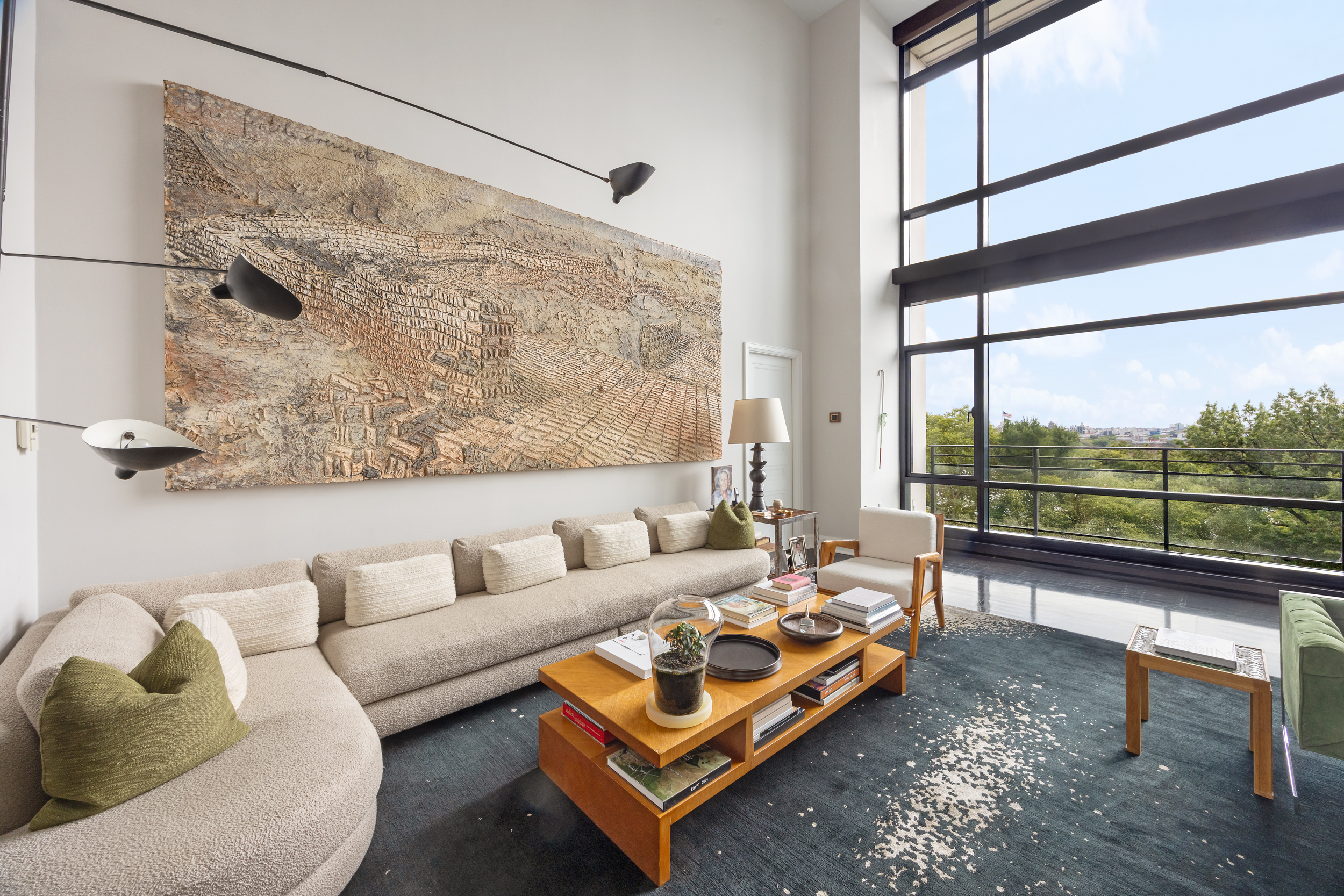 170 East End Avenue, Unit 8EF Manhattan, NY 10128 - Photo 2 of 34 a living room with furniture and a floor to ceiling window