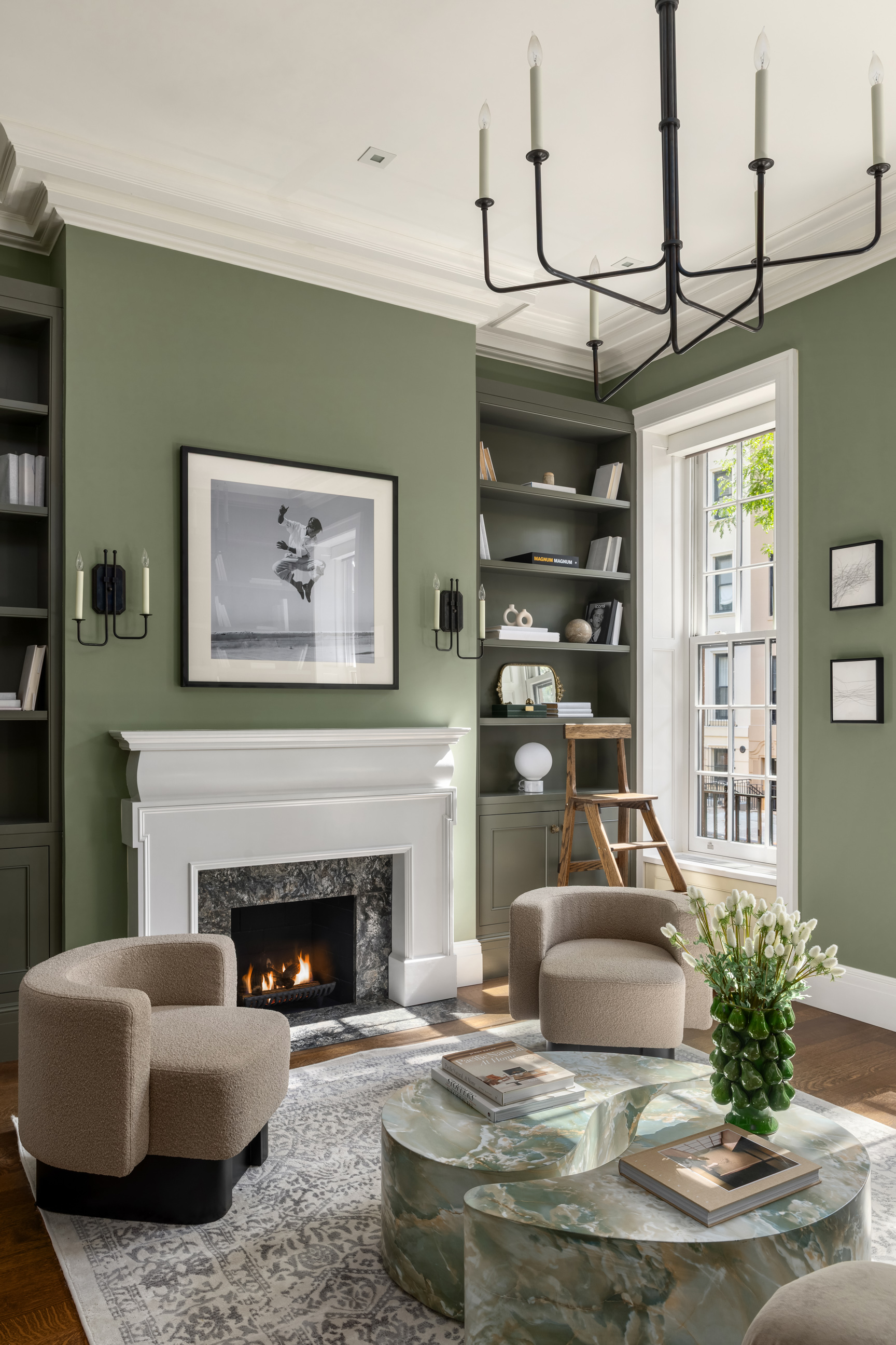 157 East 65th Street Manhattan, NY 10065 - Photo 6 of 28 a living room with furniture and a fireplace